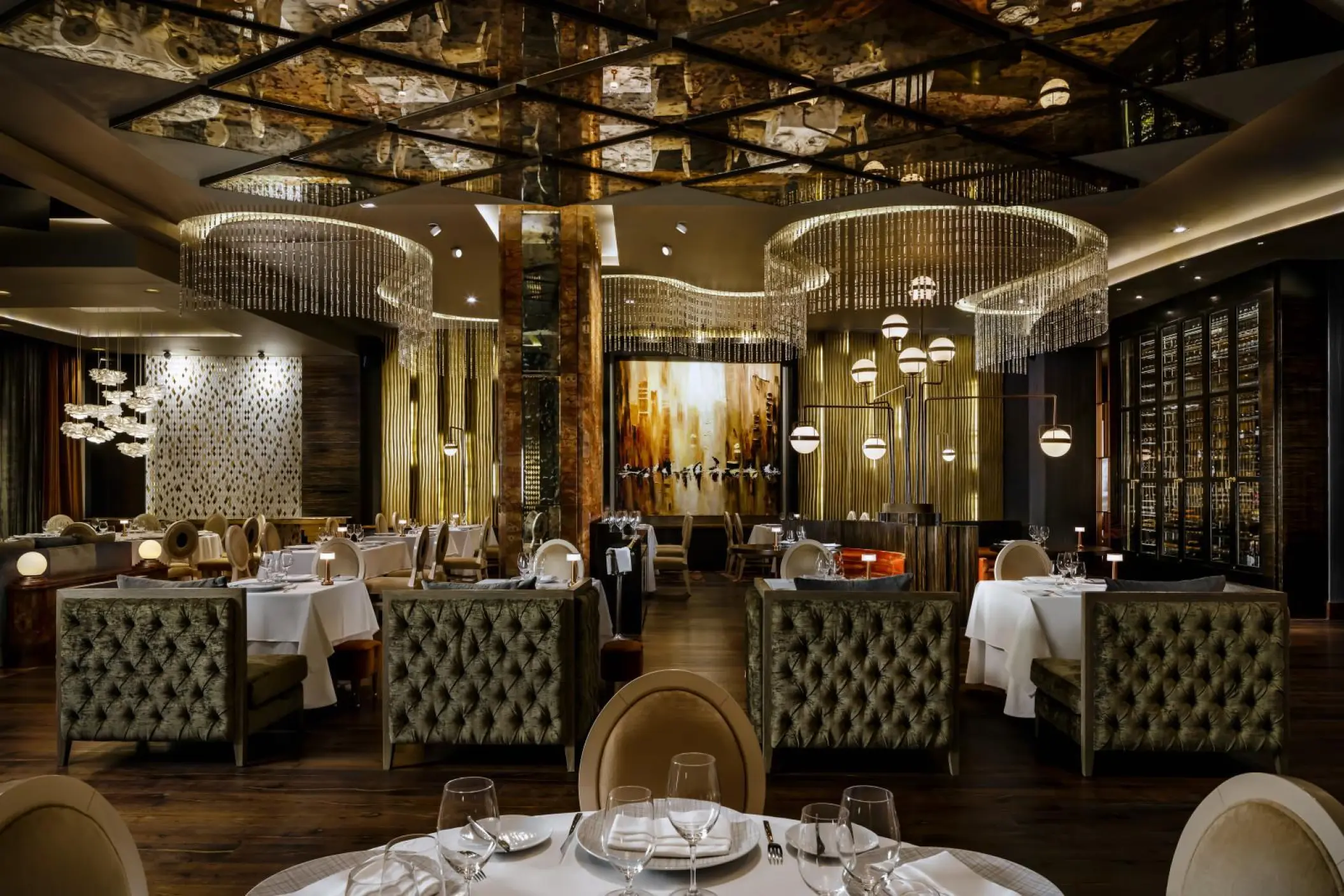 Piaf restaurant interior with crystal chandeliers and velvet seating at Grand Velas Los Cabos, Cabo San Lucas