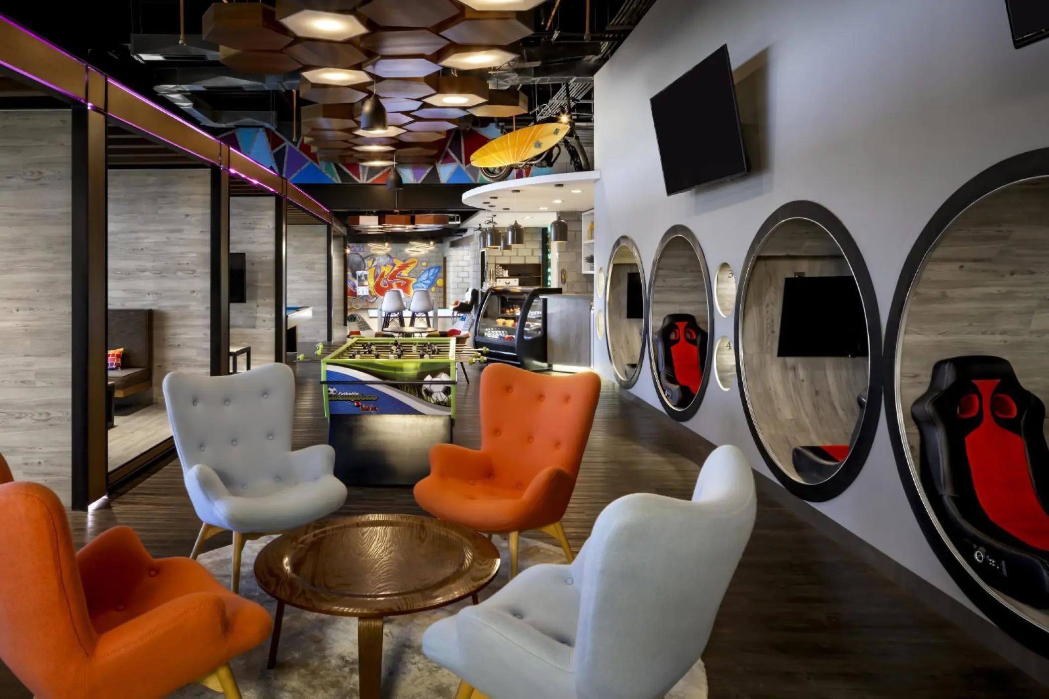 Teen club with gaming pods, foosball, and lounge seating at Grand Velas Los Cabos, Cabo San Lucas