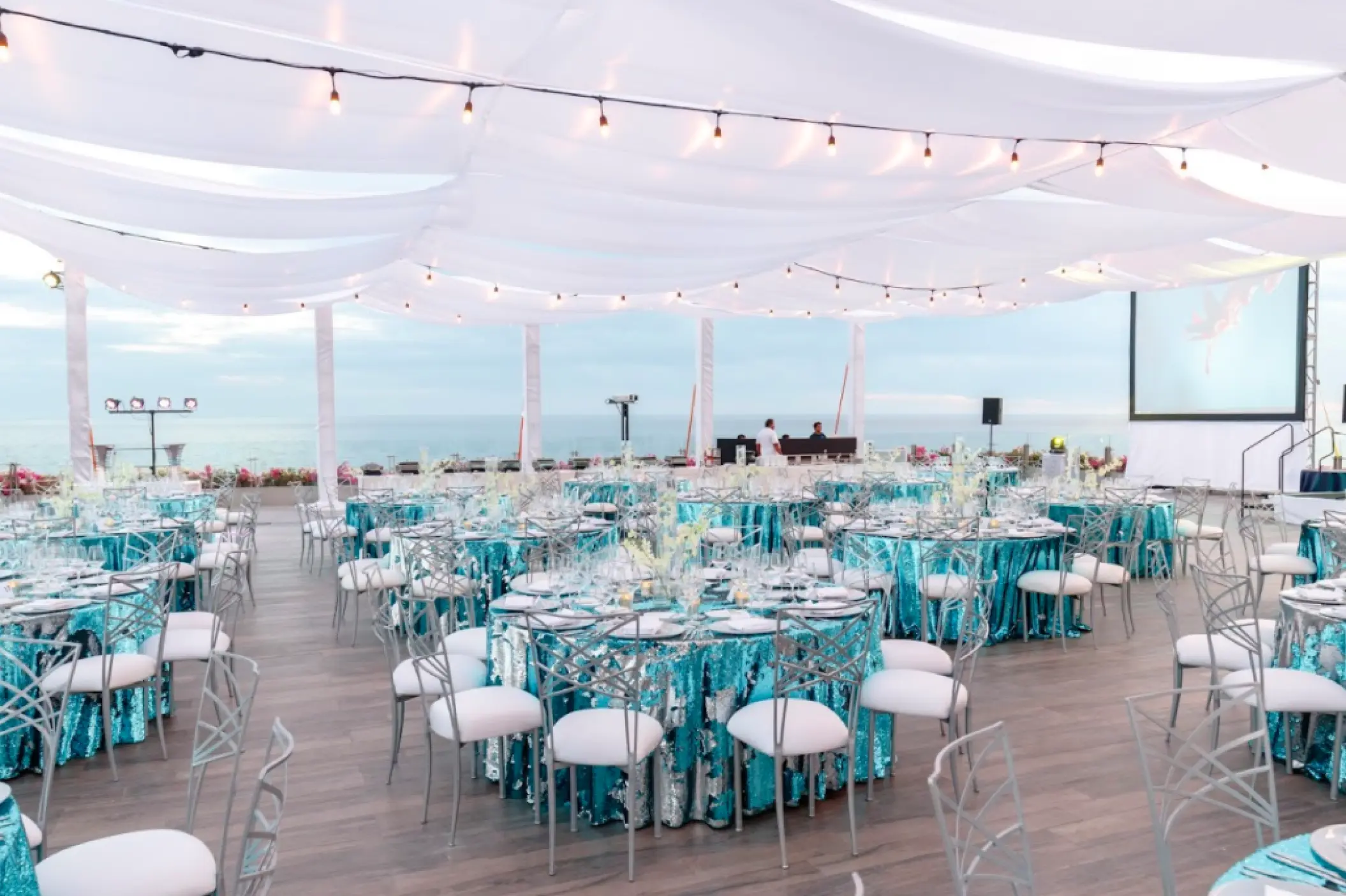 Terraza del Mar wedding reception with blue linens and white draping at Grand Velas Los Cabos, Cabo San Lucas