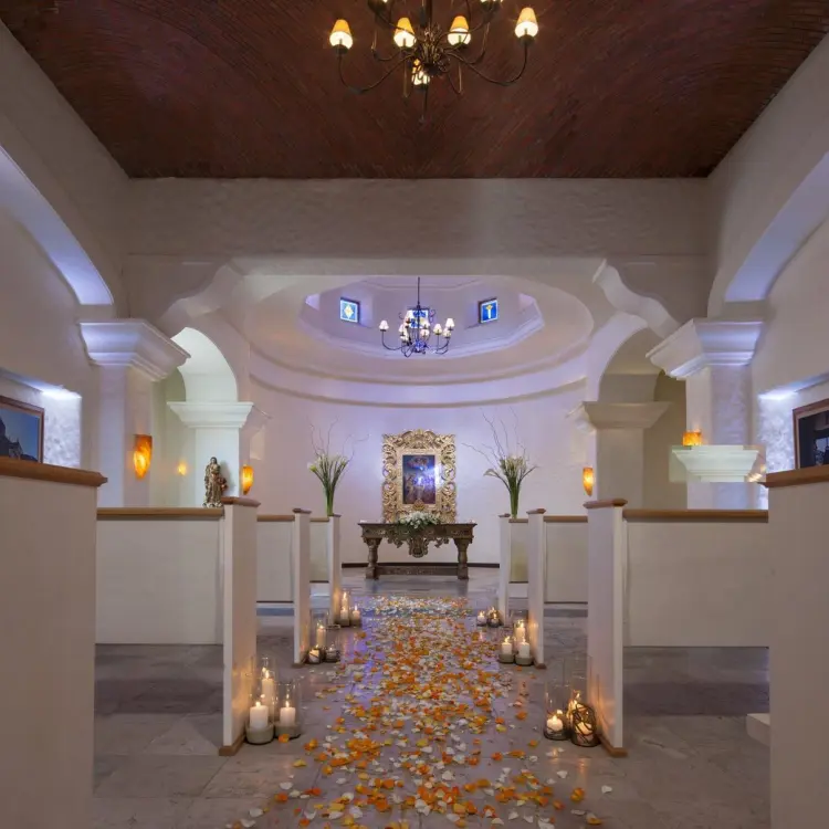 Chapel wedding ceremony aisle with petals and candles at Hacienda del Mar, Cabo San Lucas