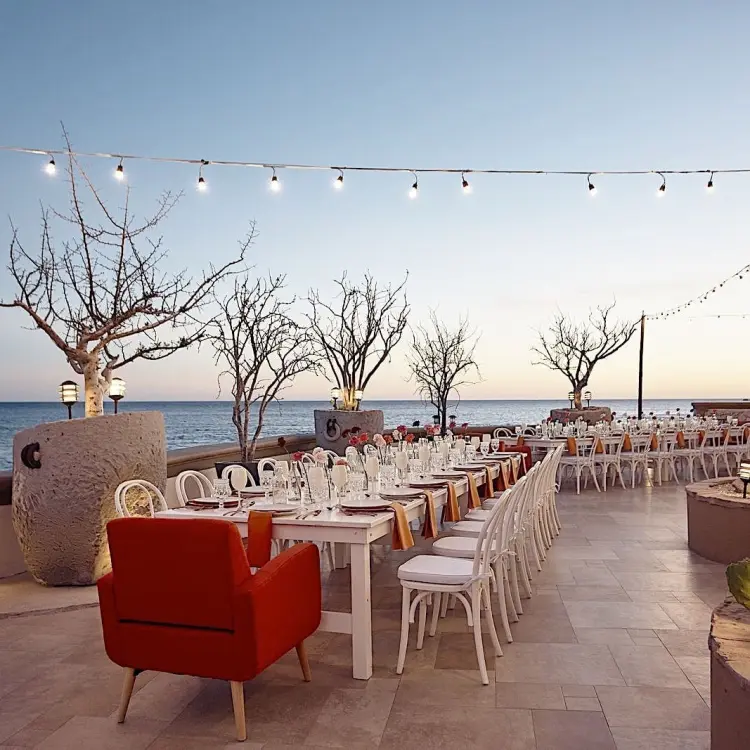 Oceanfront wedding reception with string lights at Hacienda del Mar, Cabo San Lucas