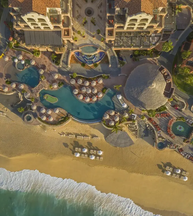 Aerial view of Hacienda del Mar beachfront pools and main building, Cabo San Lucas