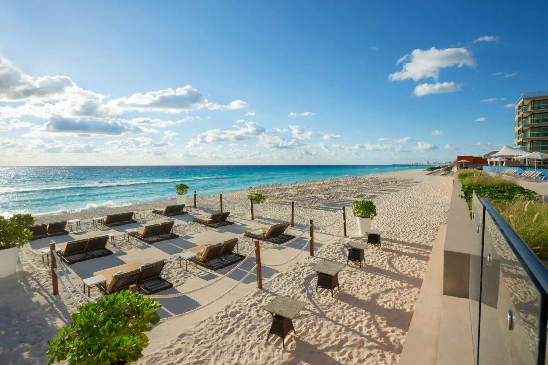 White sand beach with lounge chairs at Hard Rock Cancun, Cancun
