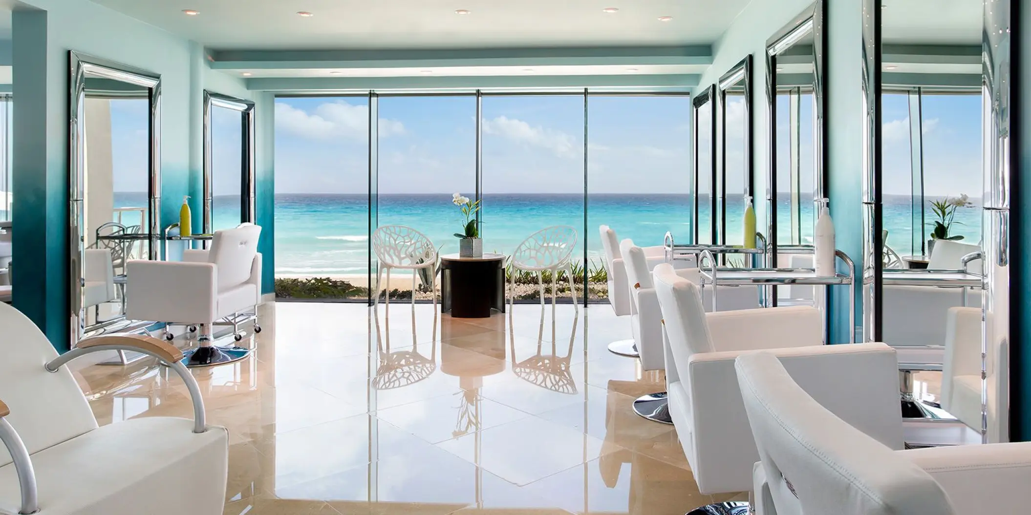 Beauty salon with oceanfront views and white chairs at Hard Rock Cancun