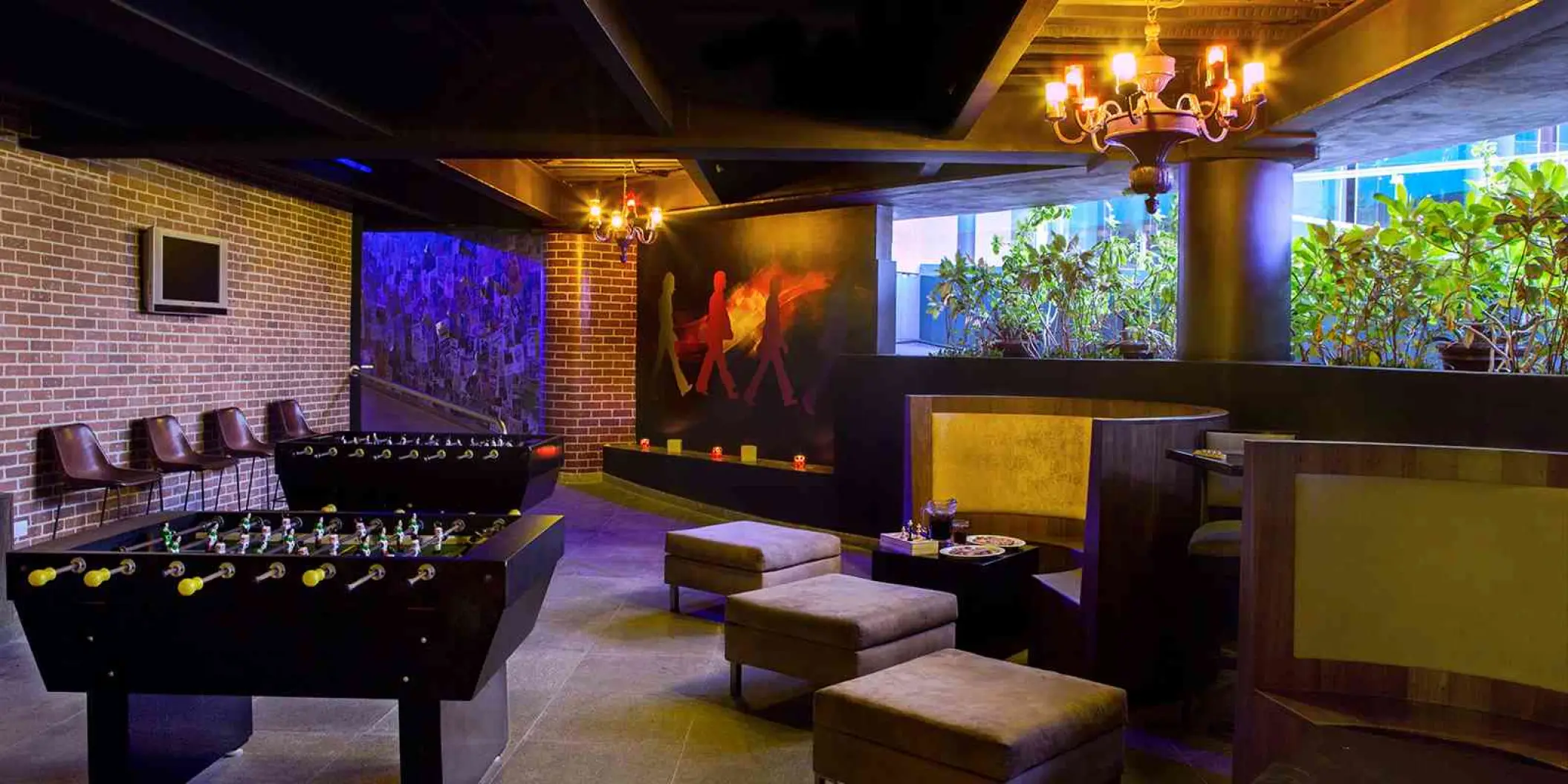 Cavern Club game room with foosball tables and lounge seating at Hard Rock Cancun