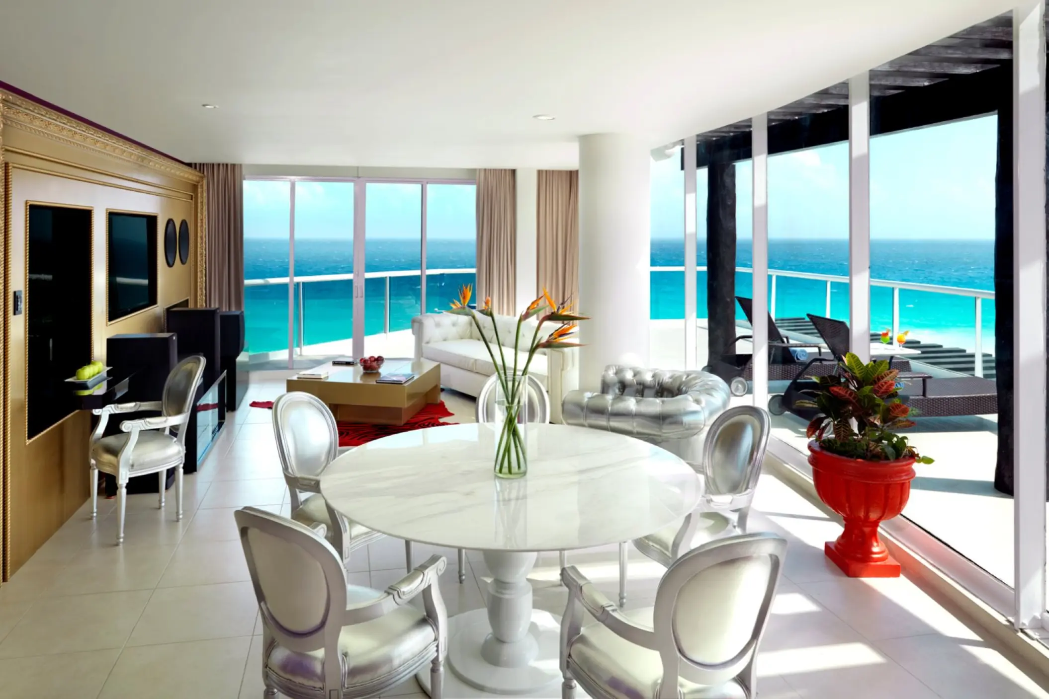 Modern suite living and dining area with ocean views at Hard Rock Cancun, Cancun