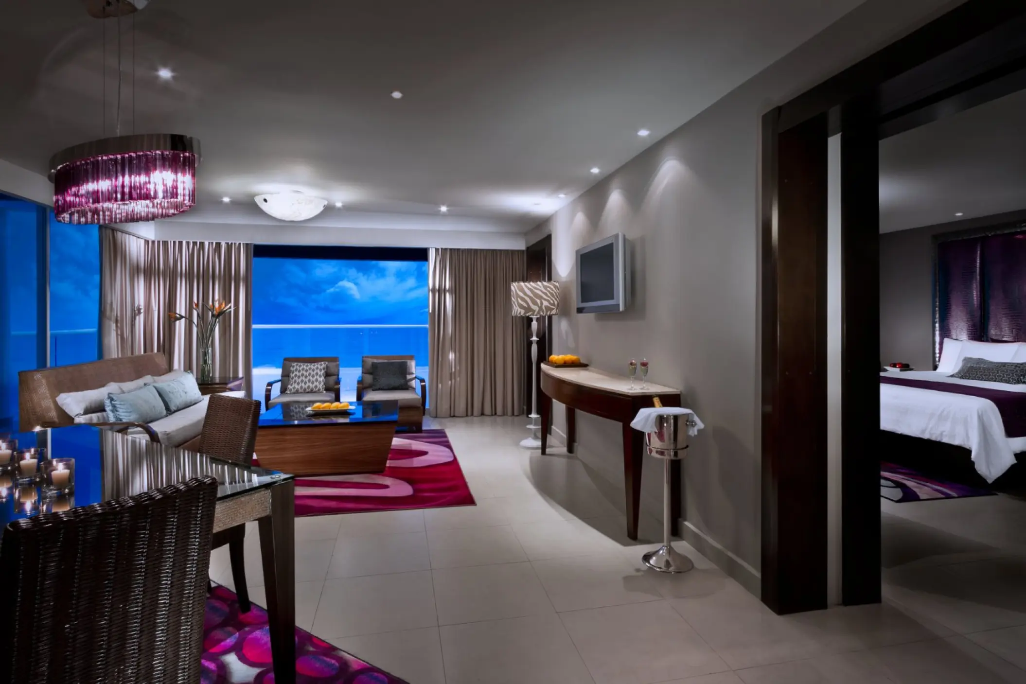 Hard Rock Cancun guest suite living area with ocean views and separate bedroom, Cancun