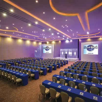 Indoor meeting room with purple lighting and blue linens at Hard Rock Cancun, Cancun