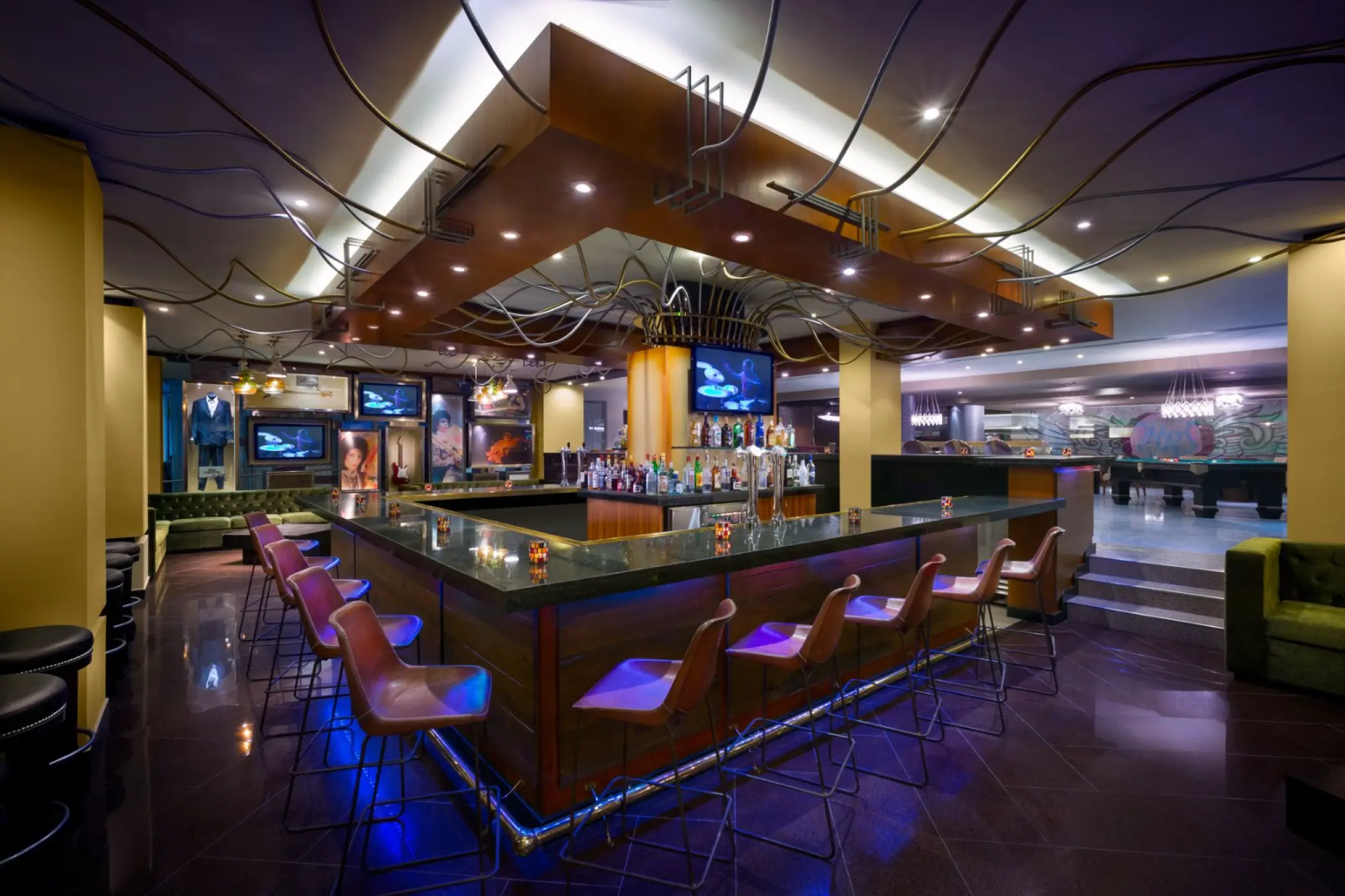 Smash Bar with purple accent lighting and modern barstools at Hard Rock Cancun