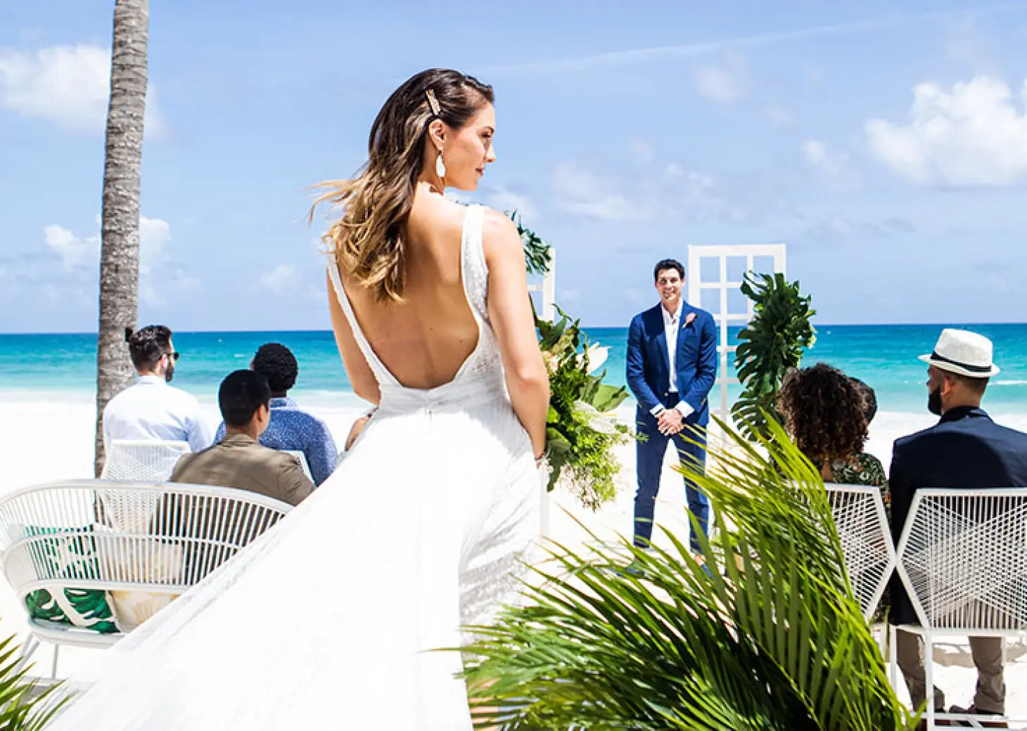 Bride walking down the aisle for a beach ceremony at Hard Rock Cancun