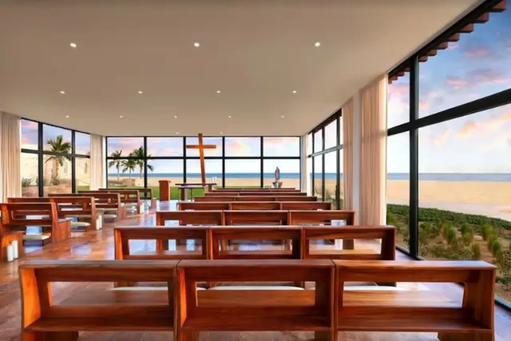 Modern oceanfront wedding chapel with wooden pews at Hard Rock Los Cabos, Cabo San Lucas