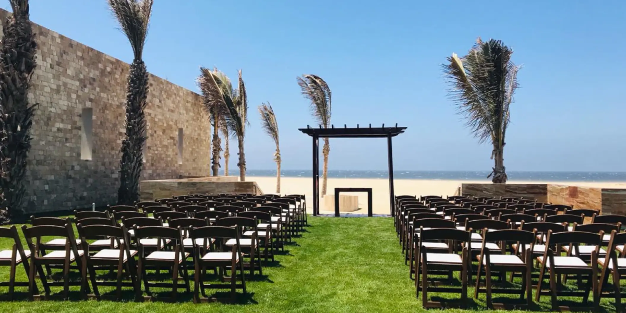 Coba Garden wedding ceremony setup with beach views at Hard Rock Los Cabos, Cabo San Lucas