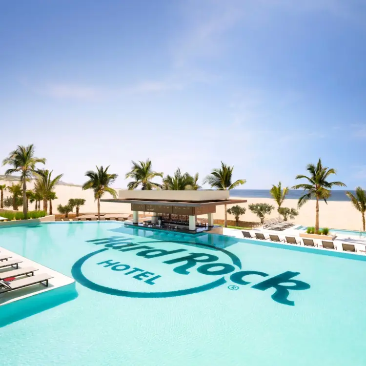 Swim-up bar and pool with the Hard Rock logo at Hard Rock Hotel Los Cabos, Cabo San Lucas