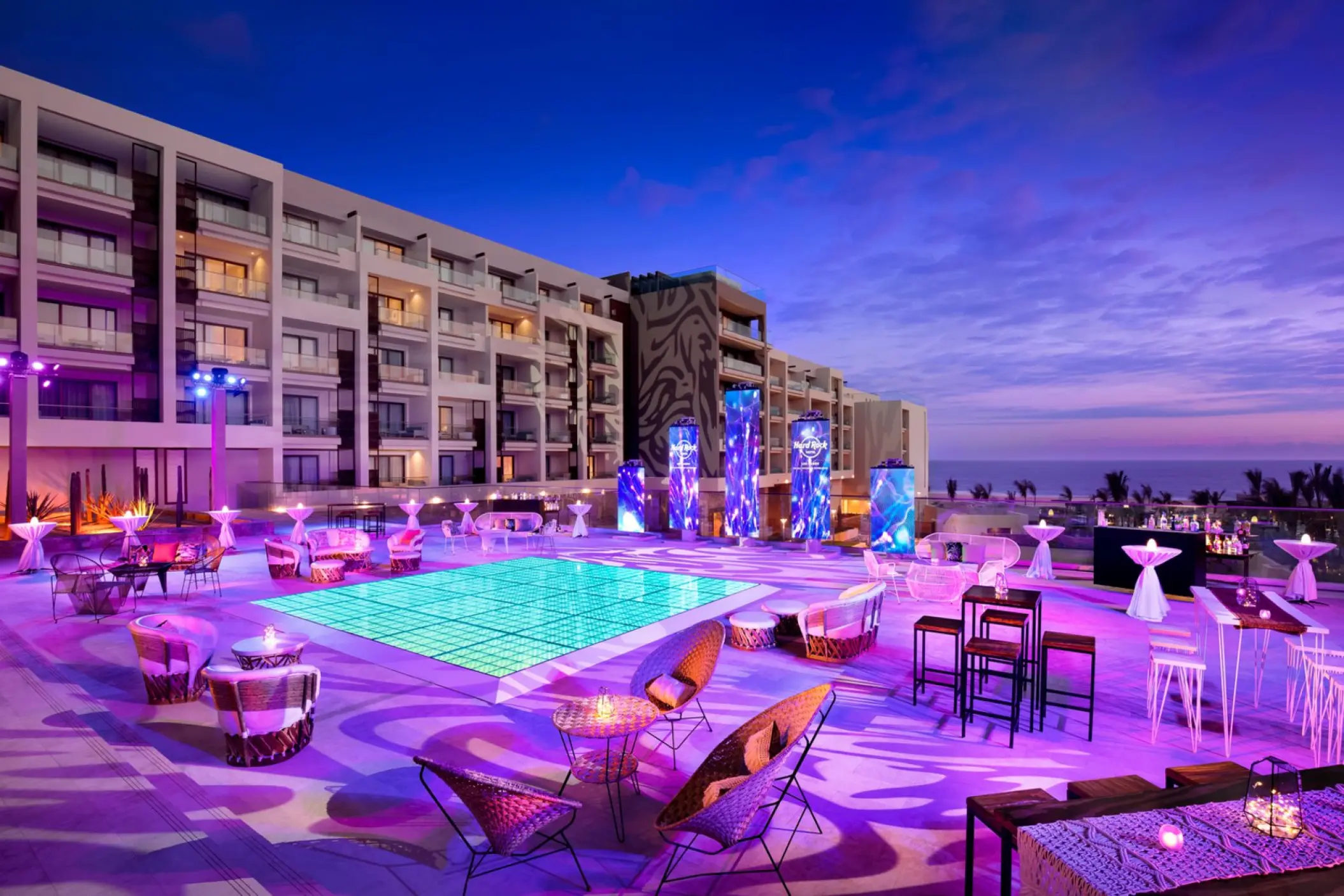 Serenade Terrace cocktail reception with purple lighting and pool at Hard Rock Los Cabos, Cabo San Lucas