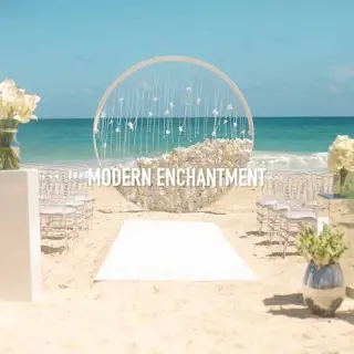 Modern Enchantment beach ceremony with circular floral arch at Hard Rock Riviera Maya