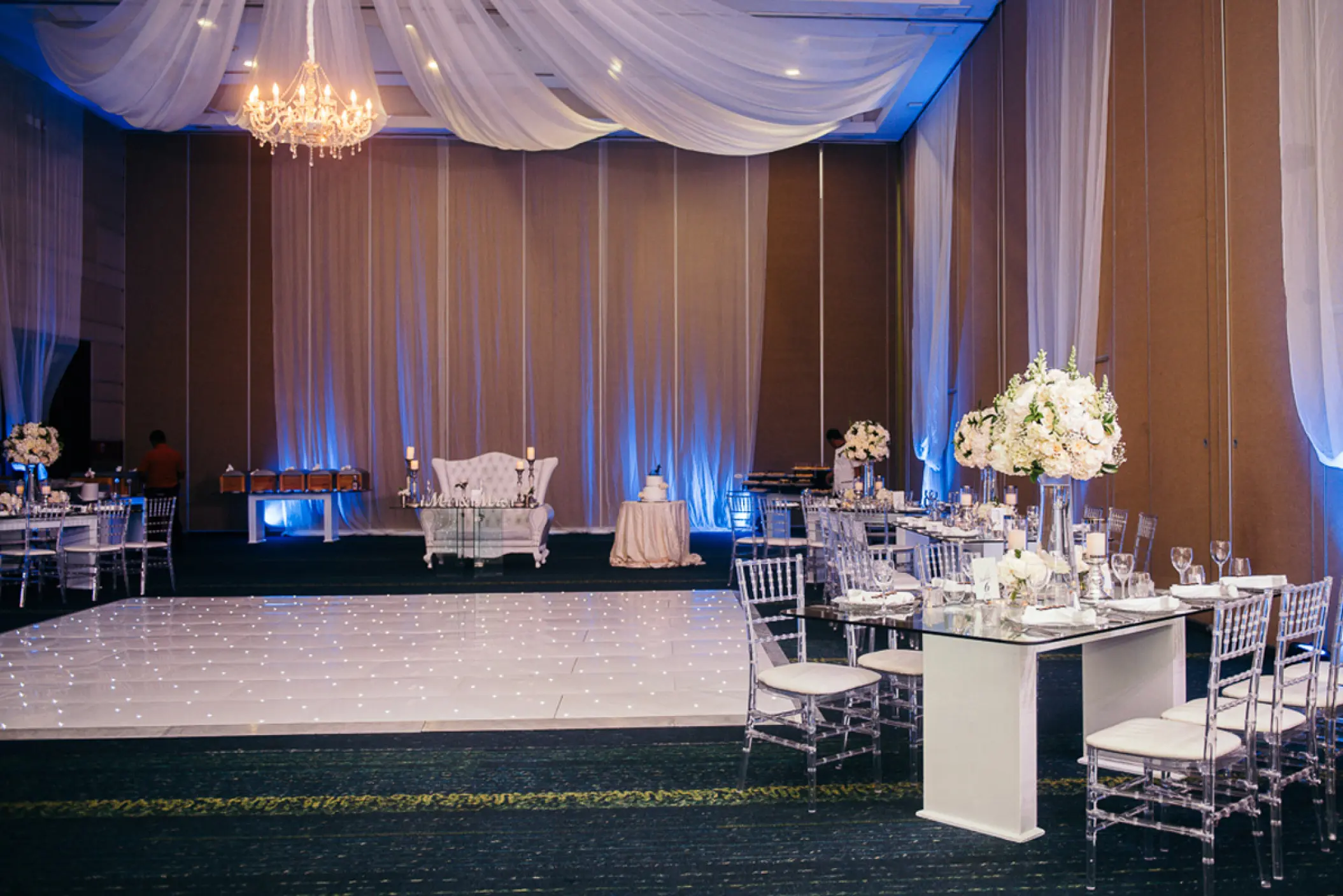 Indoor ballroom wedding reception with dance floor and white draping at Hard Rock Punta Cana, Punta Cana