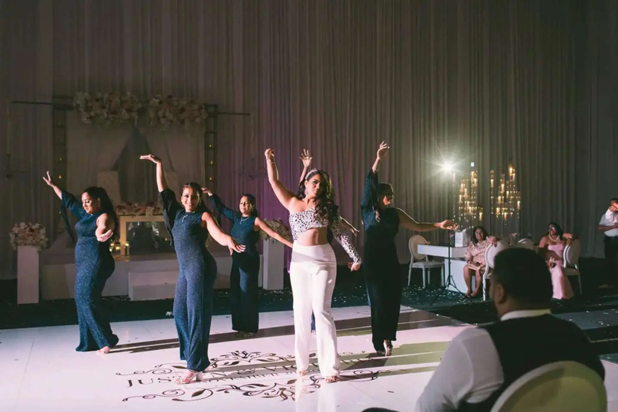 A choreographed wedding dance performance in the ballroom at Hard Rock Punta Cana
