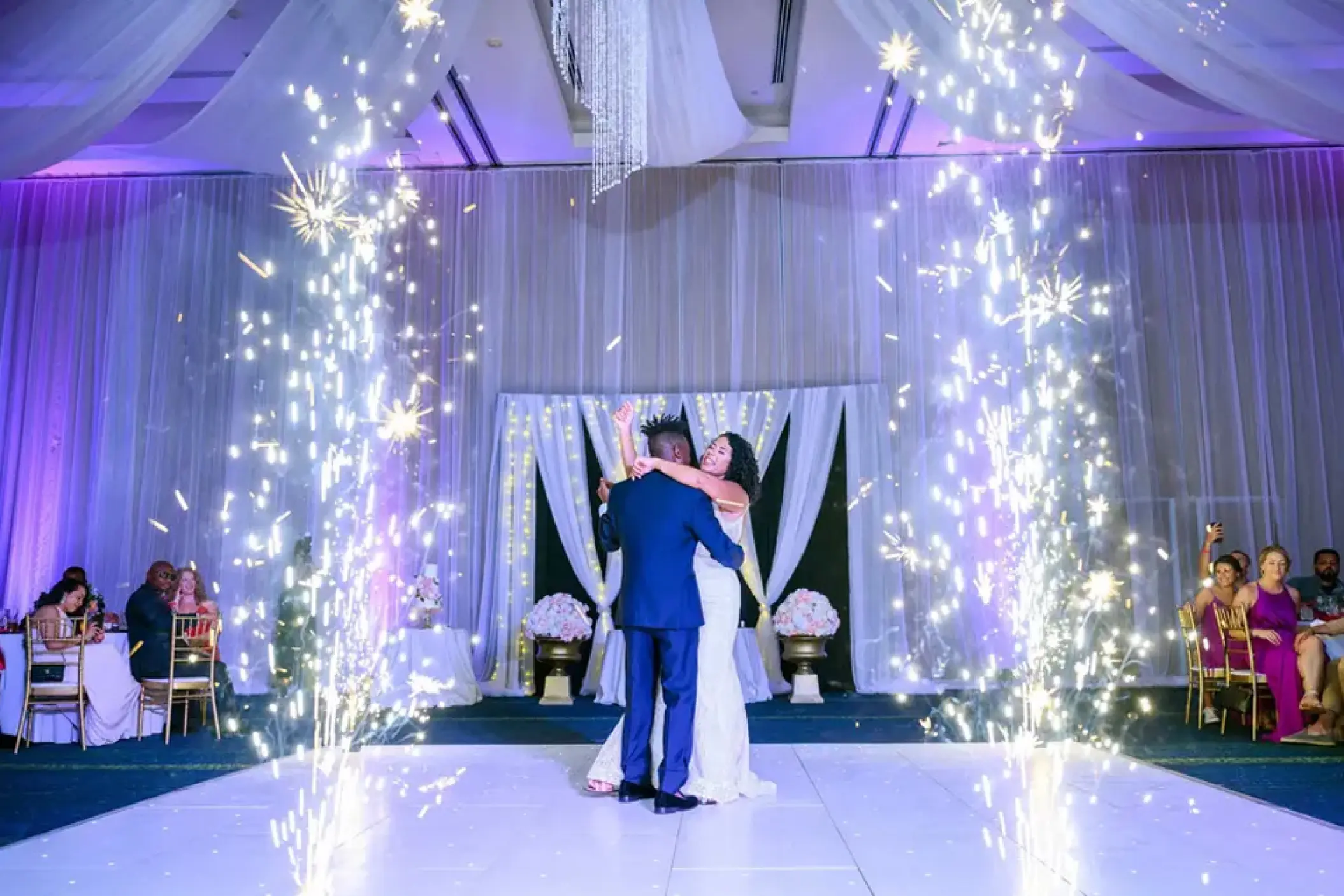 First dance with indoor cold sparklers during a ballroom wedding reception at Hard Rock Punta Cana