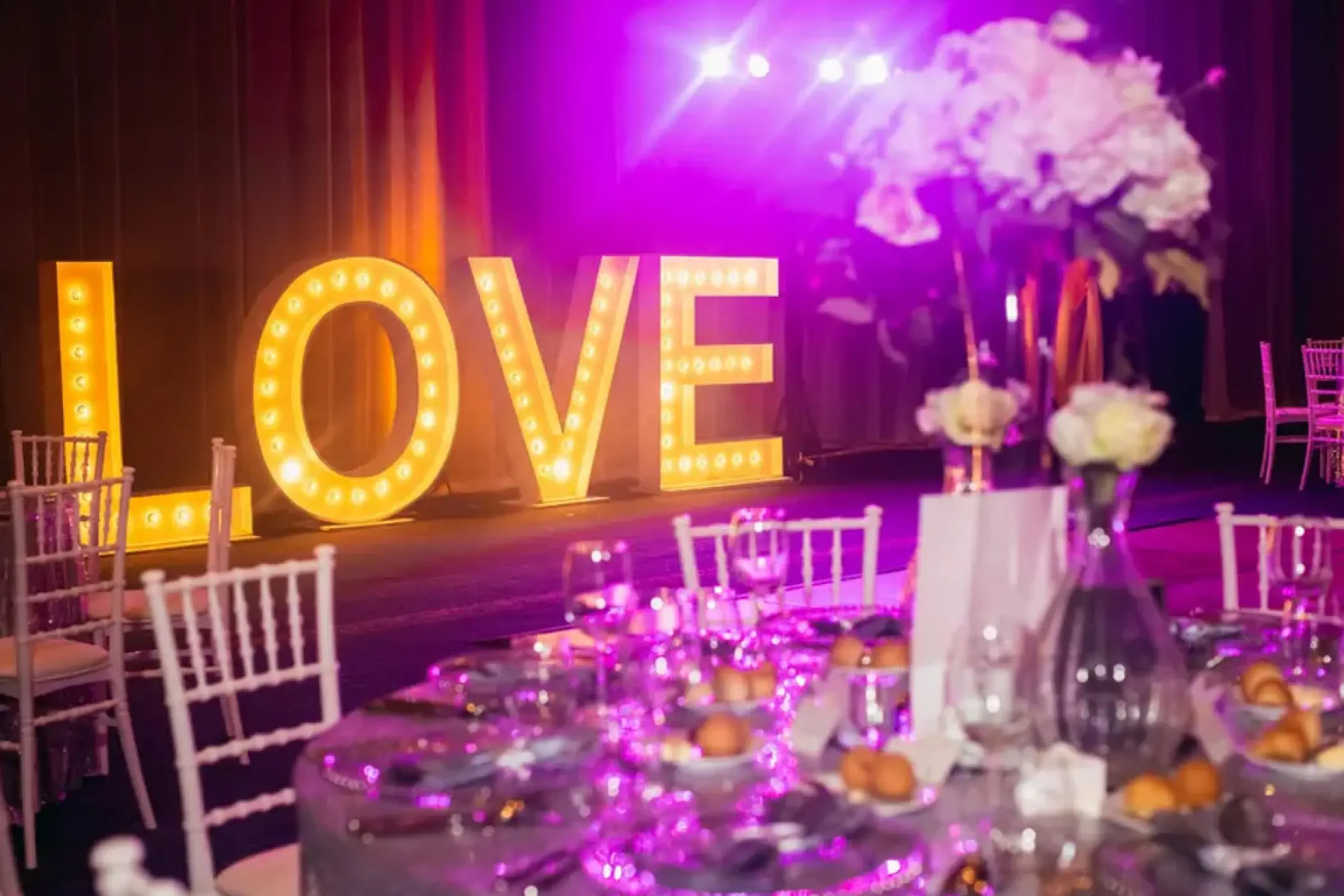 Marquee LOVE letters at a ballroom wedding reception at Hard Rock Punta Cana