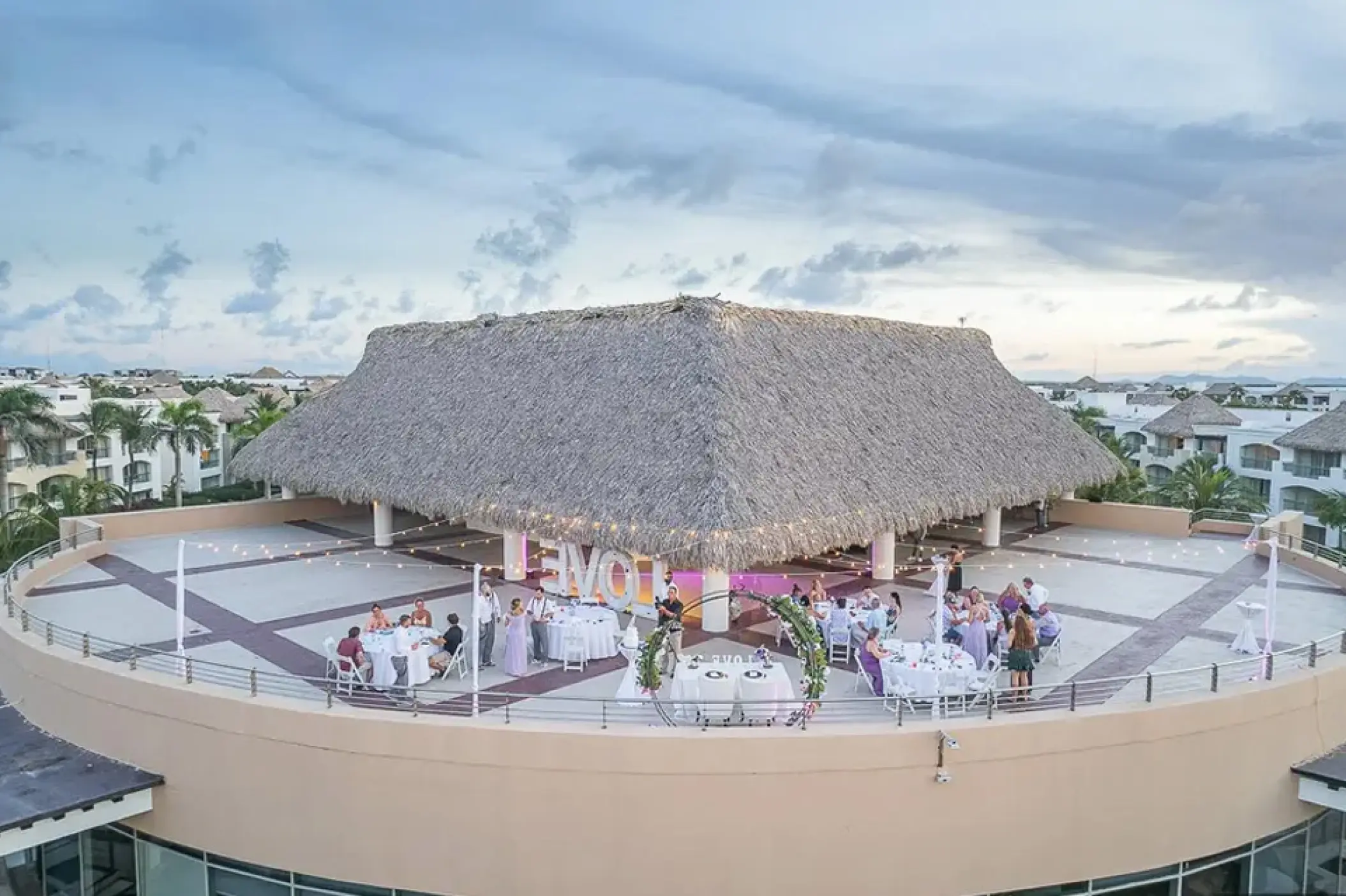 Rooftop terrace wedding reception under a palapa at Hard Rock Punta Cana
