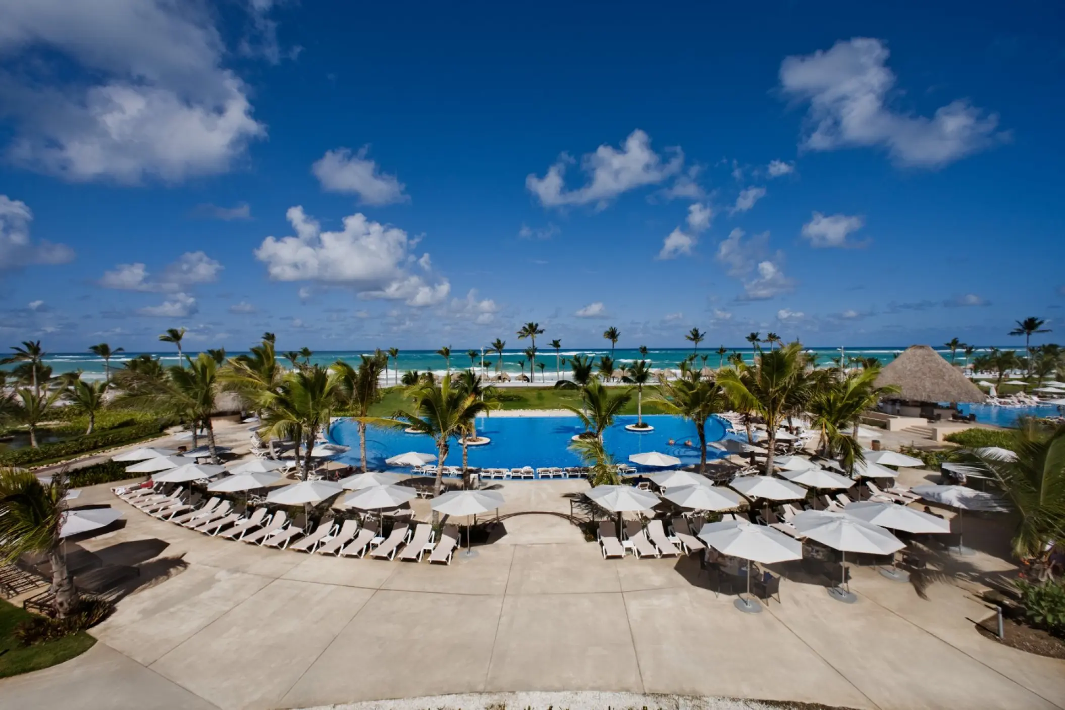 Hard Rock Punta Cana swimming pool and lounge chairs near the beach, Punta Cana