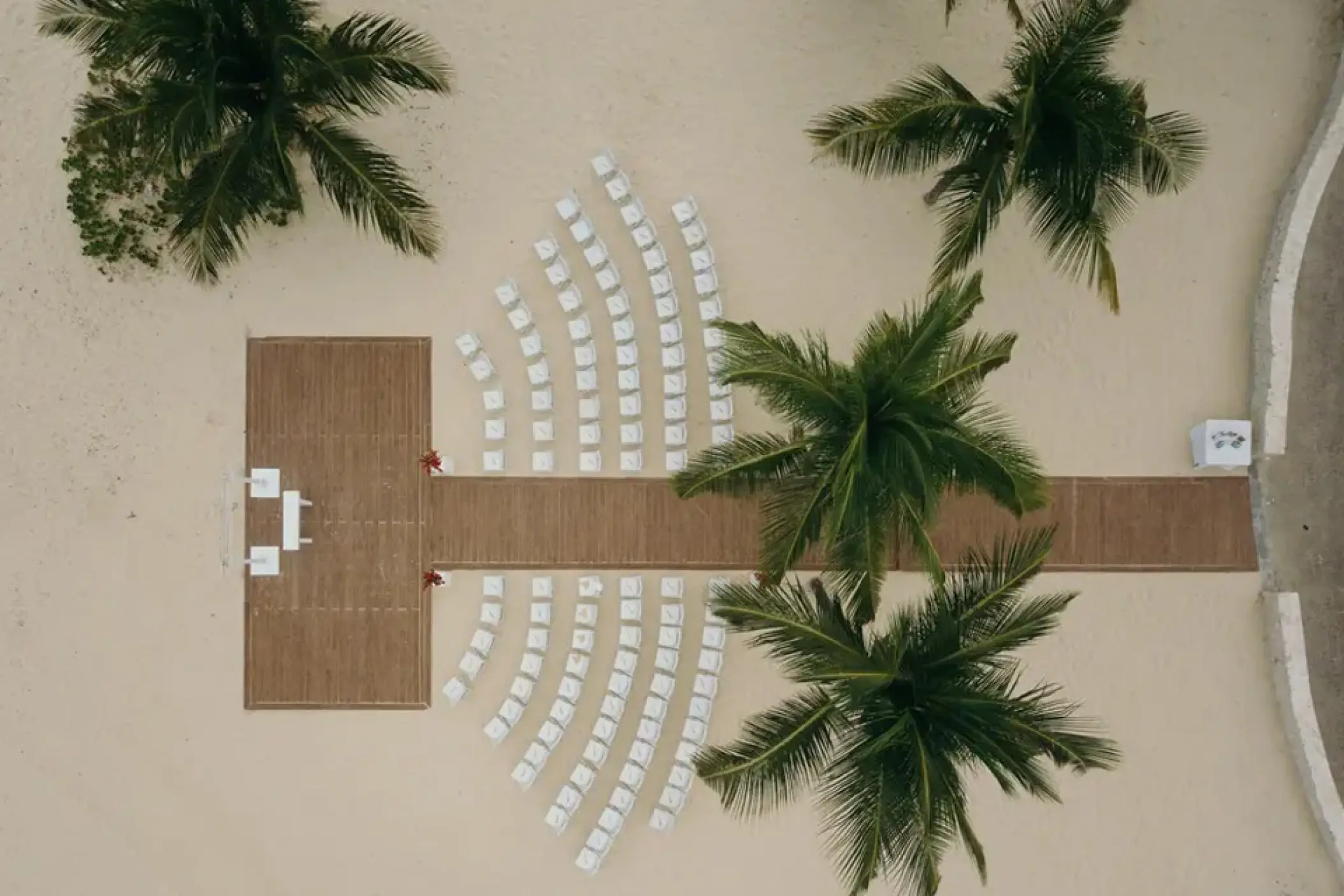 Aerial view of a beach wedding ceremony setup at Hard Rock Punta Cana