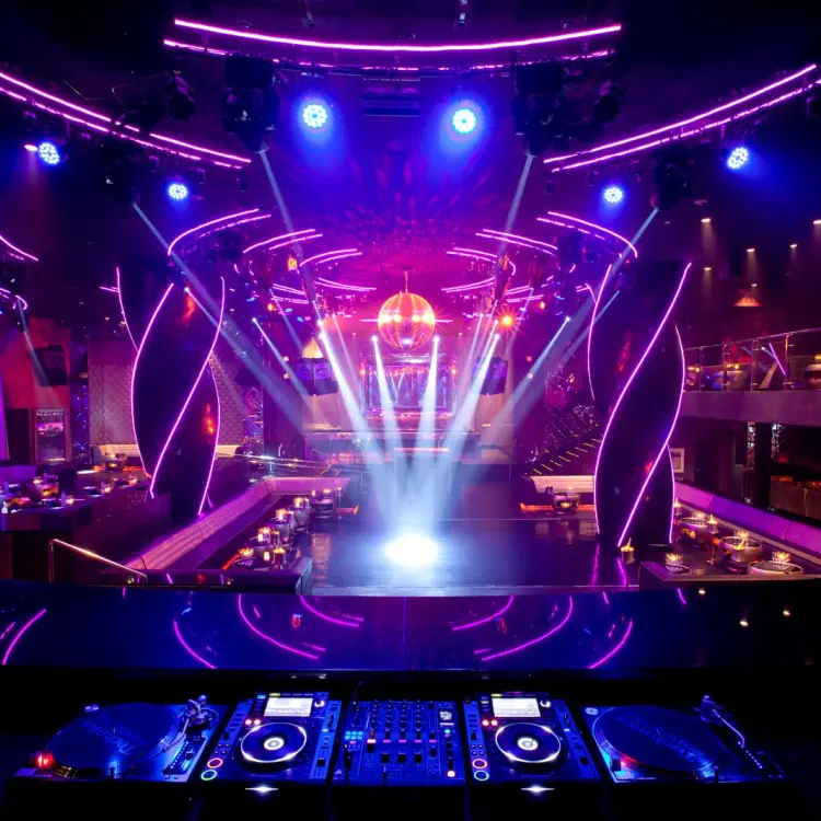 Oro Nightclub dance floor with purple lighting and DJ booth at Hard Rock Punta Cana