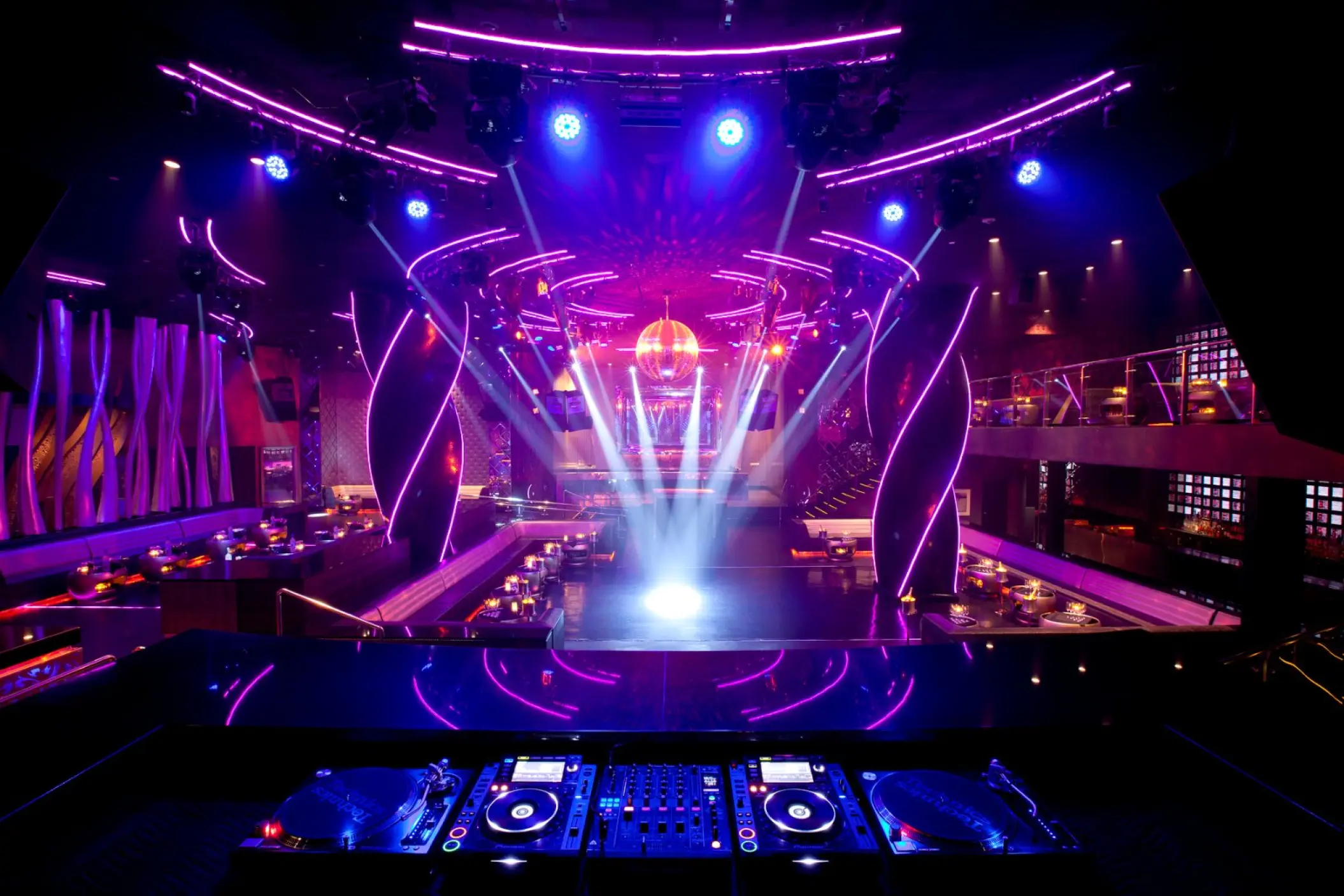 Oro Nightclub dance floor with purple lighting and DJ booth at Hard Rock Punta Cana