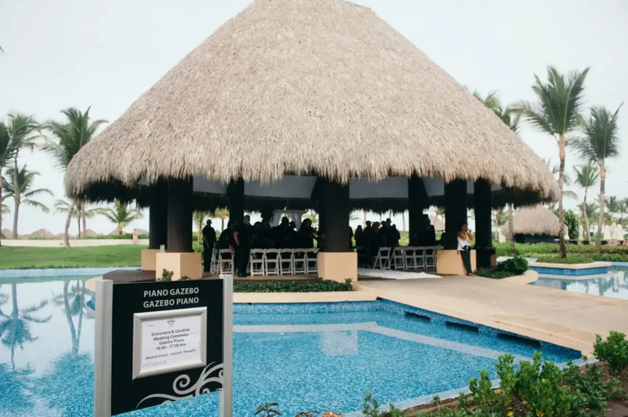 Piano Gazebo wedding ceremony setup over a pool at Hard Rock Punta Cana