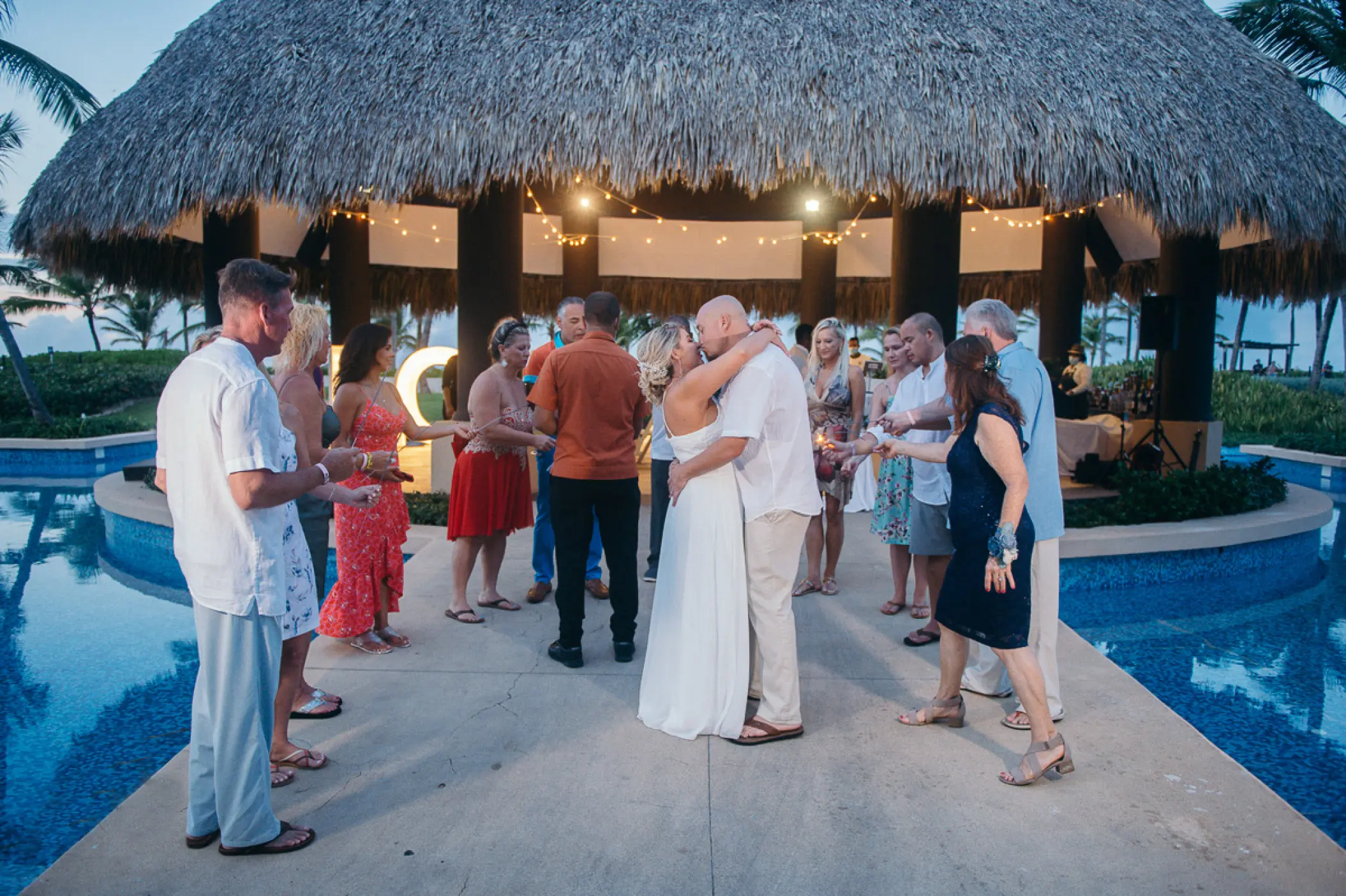 The bride and groom kissing during a wedding reception at Hard Rock Punta Cana