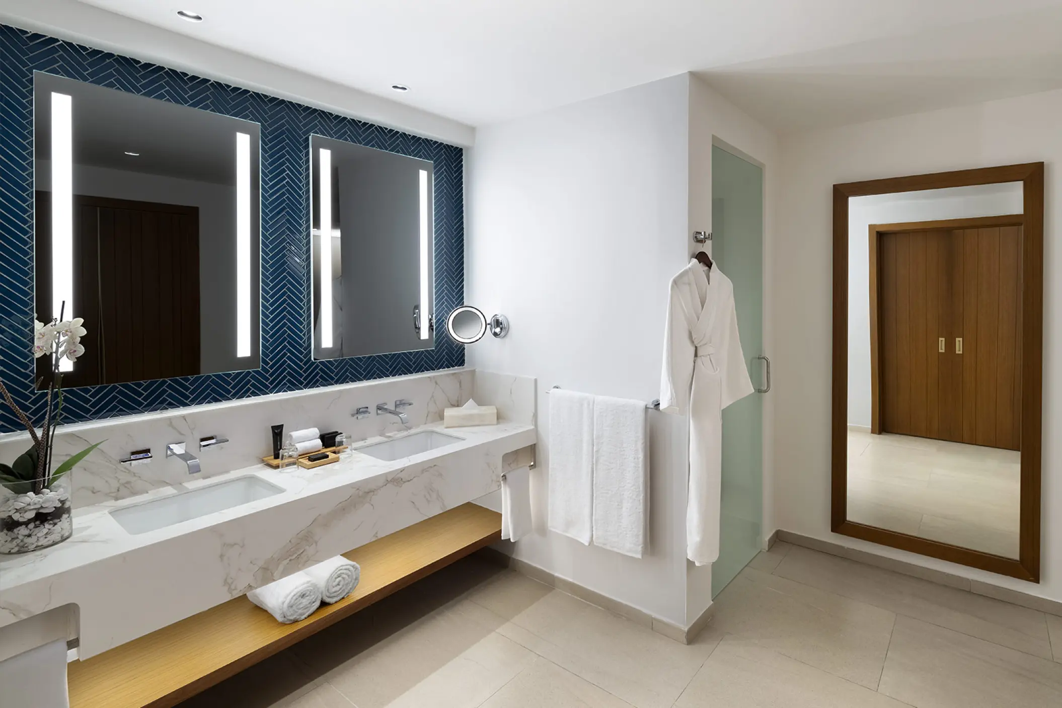 Rock Family Suite bathroom with double marble vanity and light-up mirrors at Hard Rock Punta Cana
