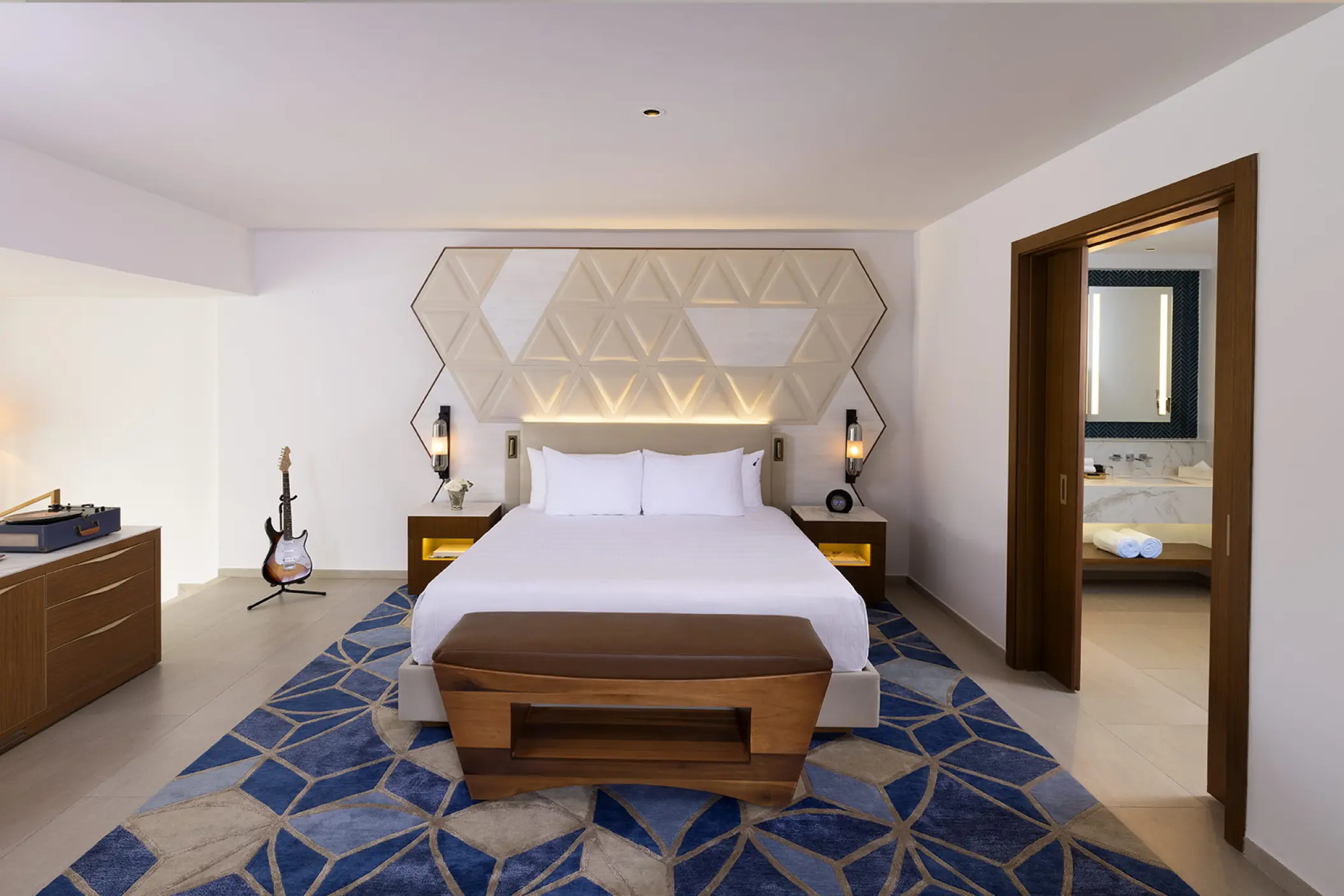 Rock Family Suite with king bed and electric guitar at Hard Rock Punta Cana