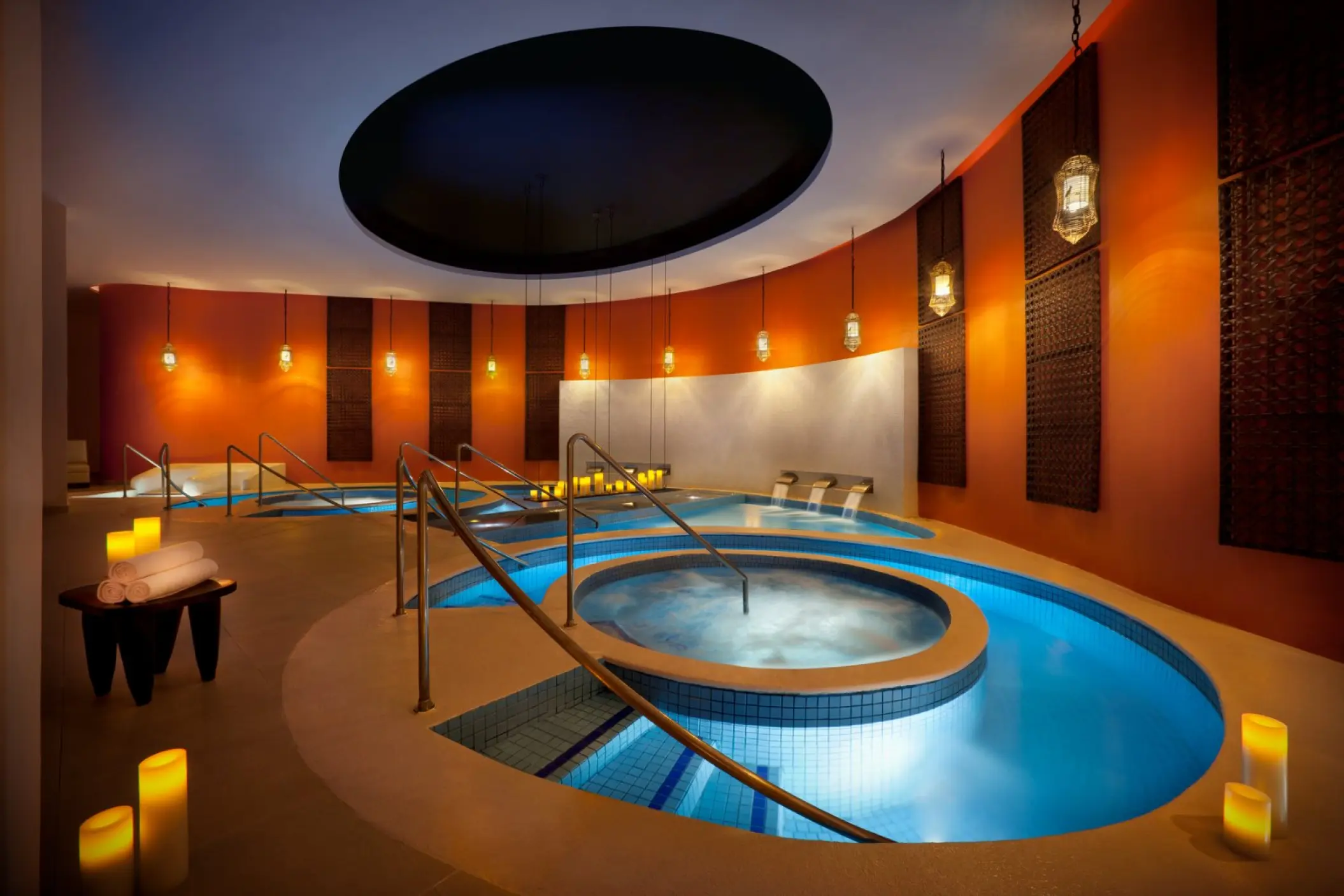 Rock Spa indoor hydrotherapy pools with candles and ambient lighting at Hard Rock Punta Cana