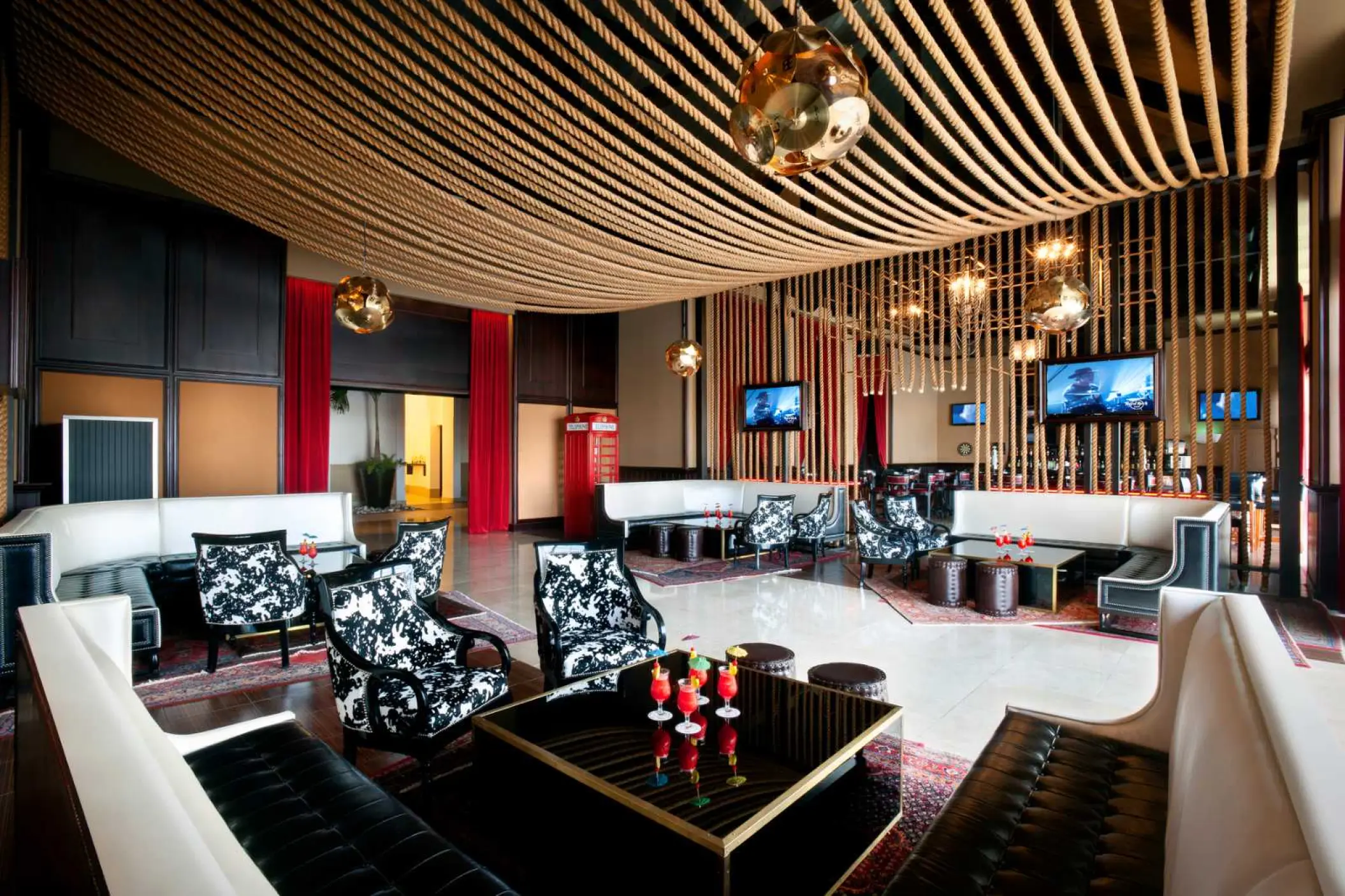 Sun Bar lounge with modern seating and rope ceiling decor at Hard Rock Punta Cana