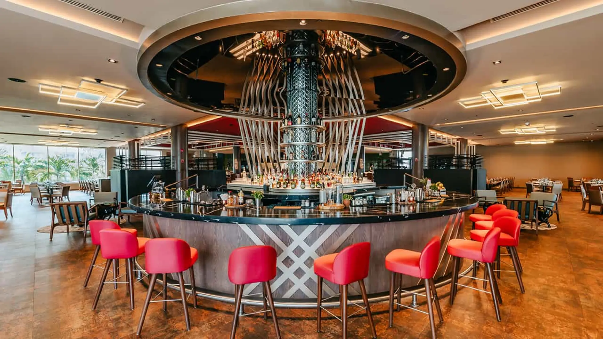 Circular bar with red chairs at Hard Rock Punta Cana