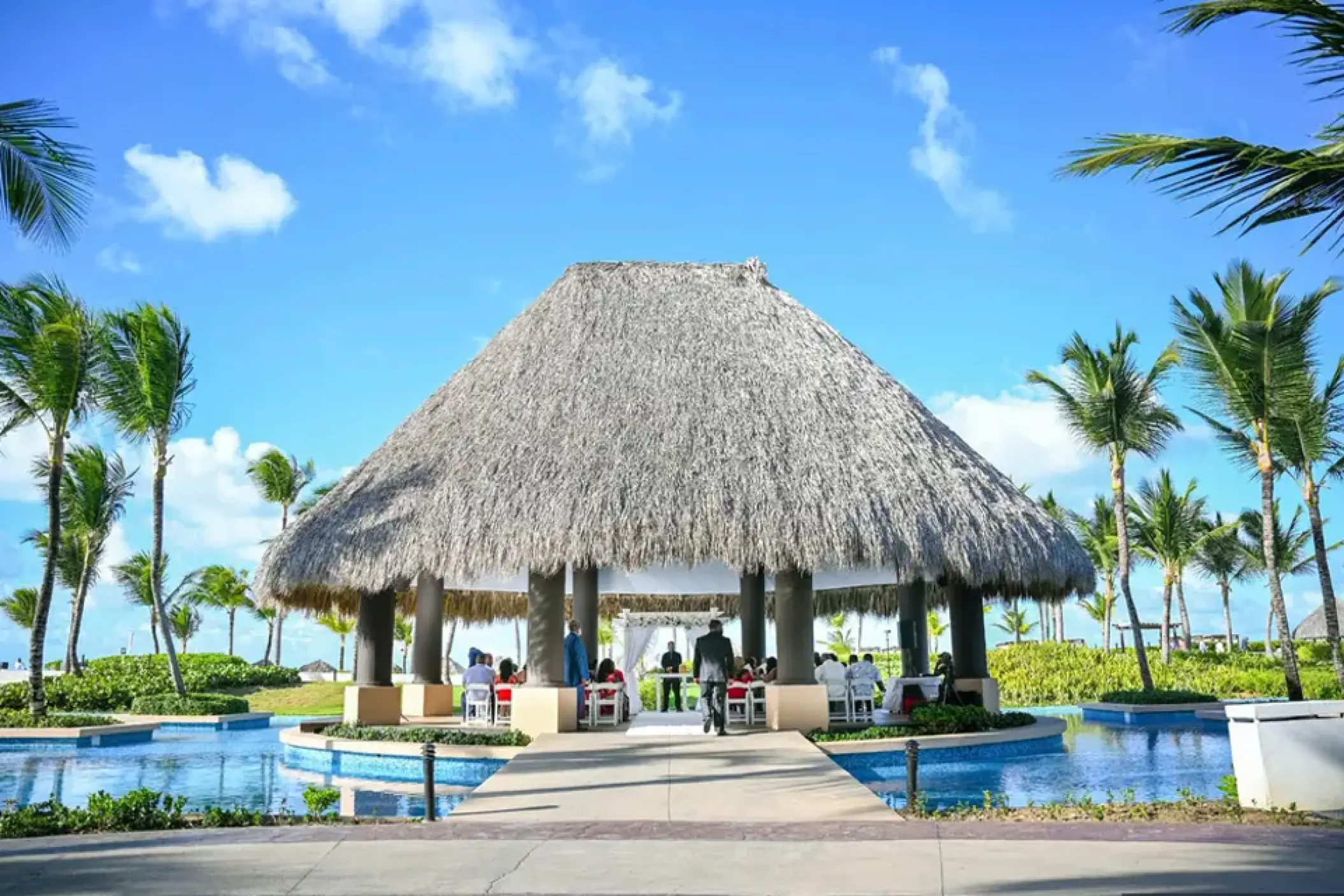 Thatched roof gazebo wedding ceremony at Hard Rock Punta Cana, Punta Cana