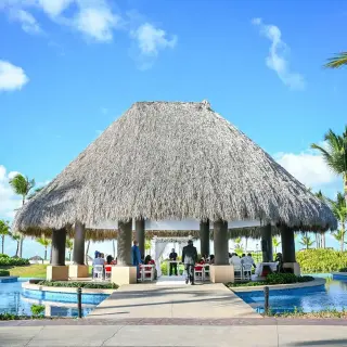 Thatched roof gazebo wedding ceremony at Hard Rock Punta Cana, Punta Cana