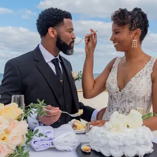 Bride and groom feeding each other cake at Haven Riviera Cancun, Riviera Maya