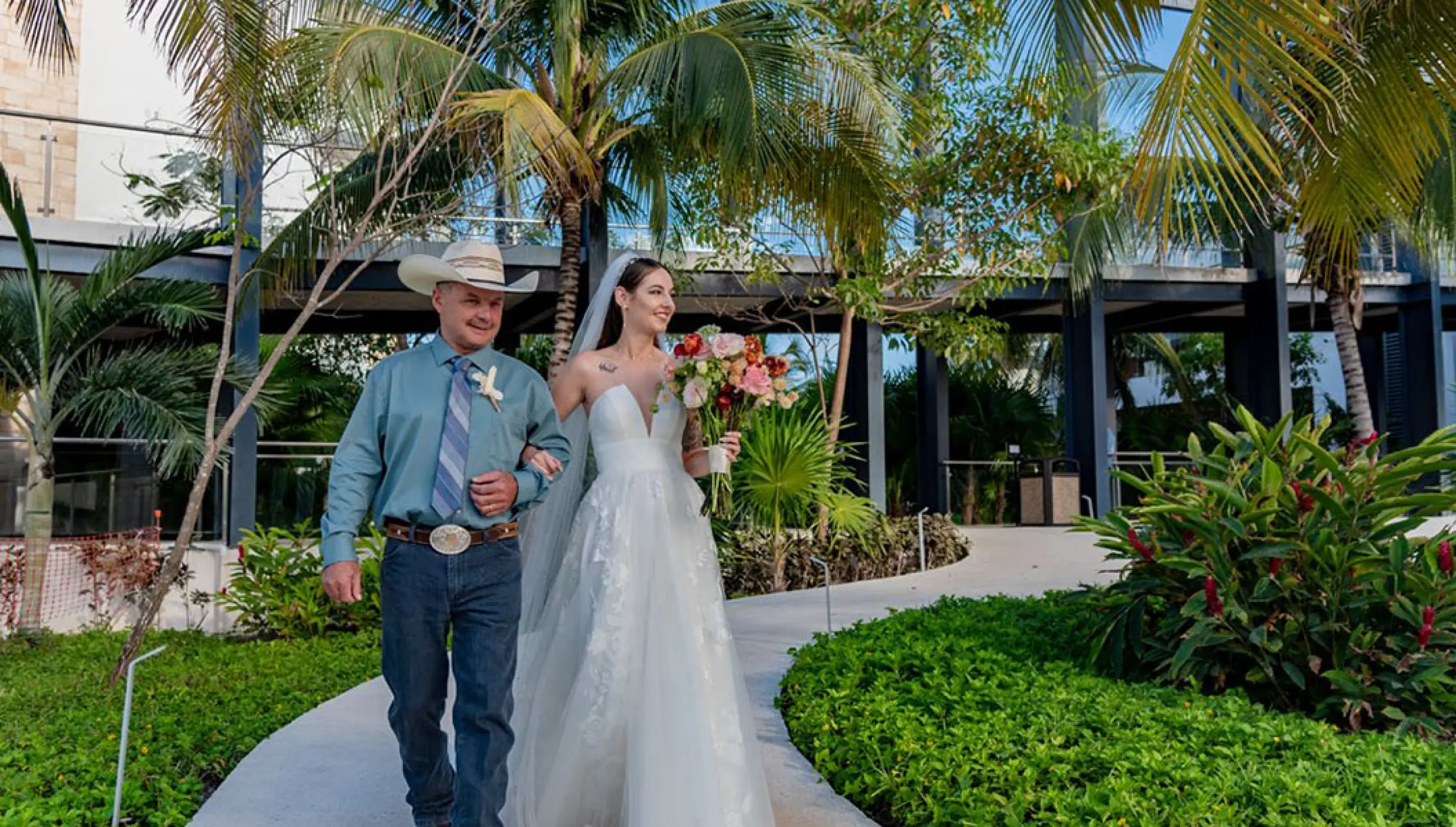 Bride walking down the isle for her Ceremony in La Ceiba Garden venue at Haven Riviera Cancun Resort.