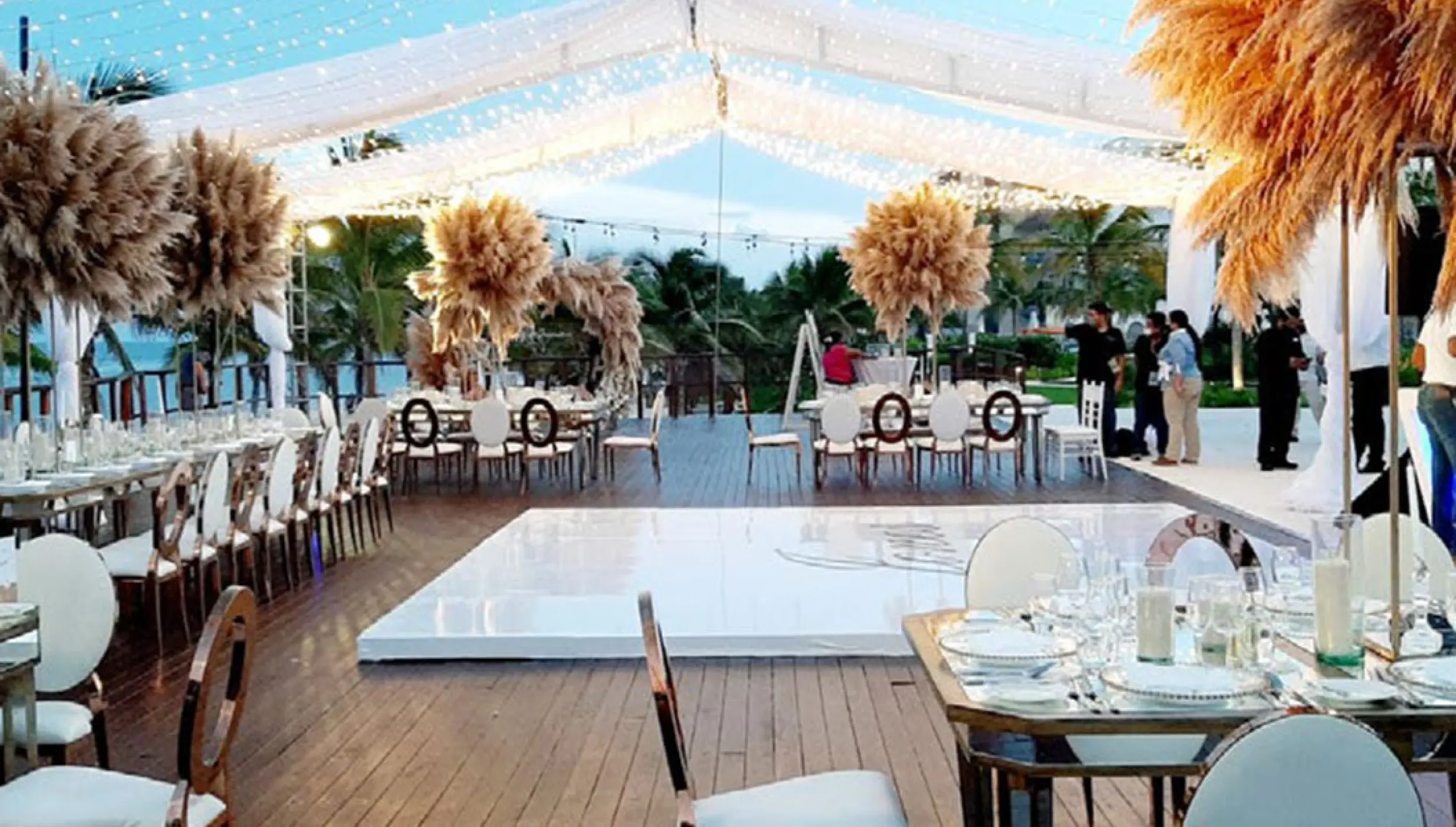 Reception setup at Vora Deck wedding venue at Haven Riviera Cancun Resort.