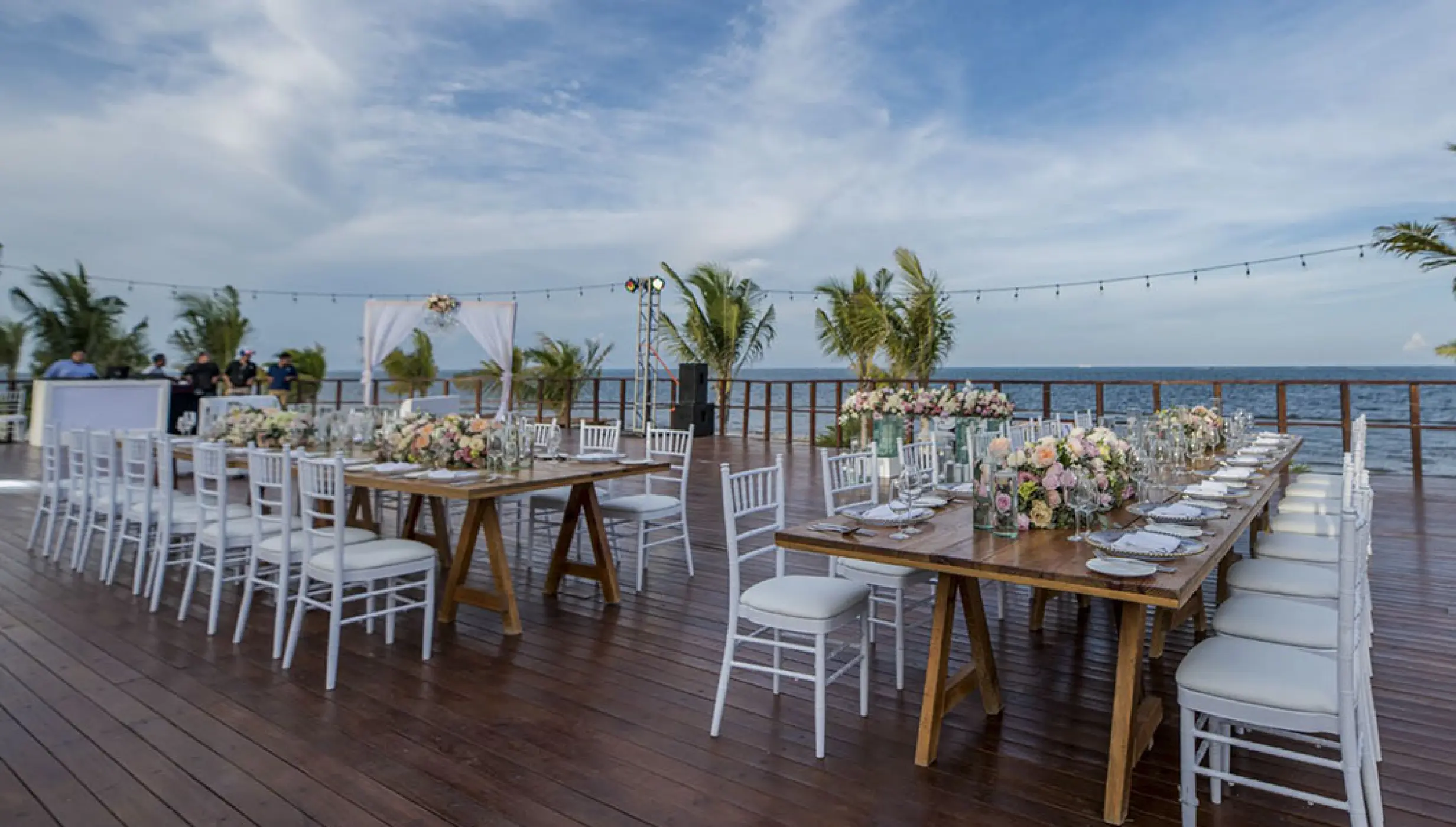 Reception setup at Vora Deck wedding venue at Haven Riviera Cancun Resort.