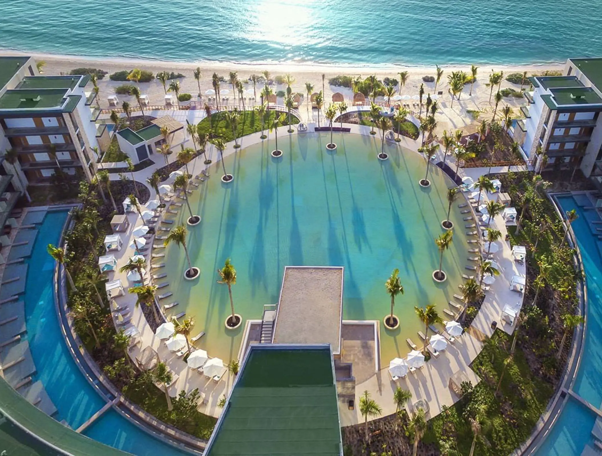 Aerial view of the circular pool and palm trees at Haven Riviera Cancun, Riviera Maya