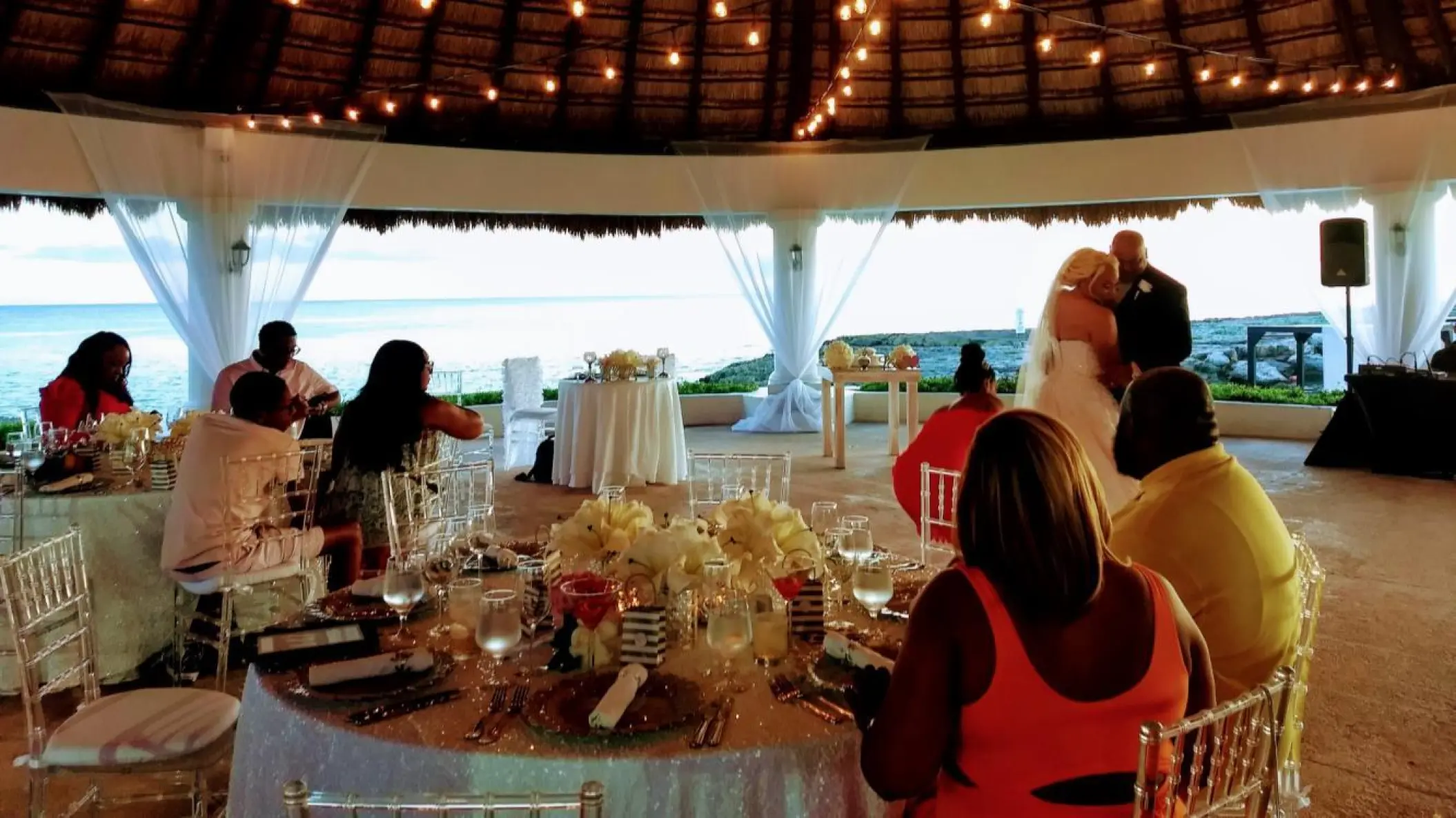 Evening wedding reception under a palapa at Hard Rock Hotel Riviera Maya
