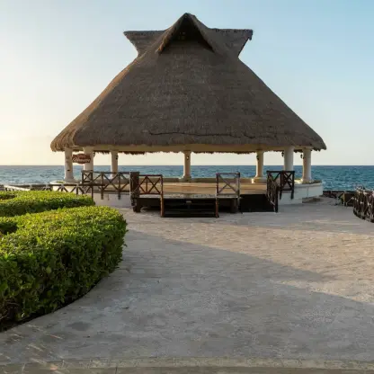 Thatched-roof Heaven Terrace wedding venue at Hard Rock Riviera Maya