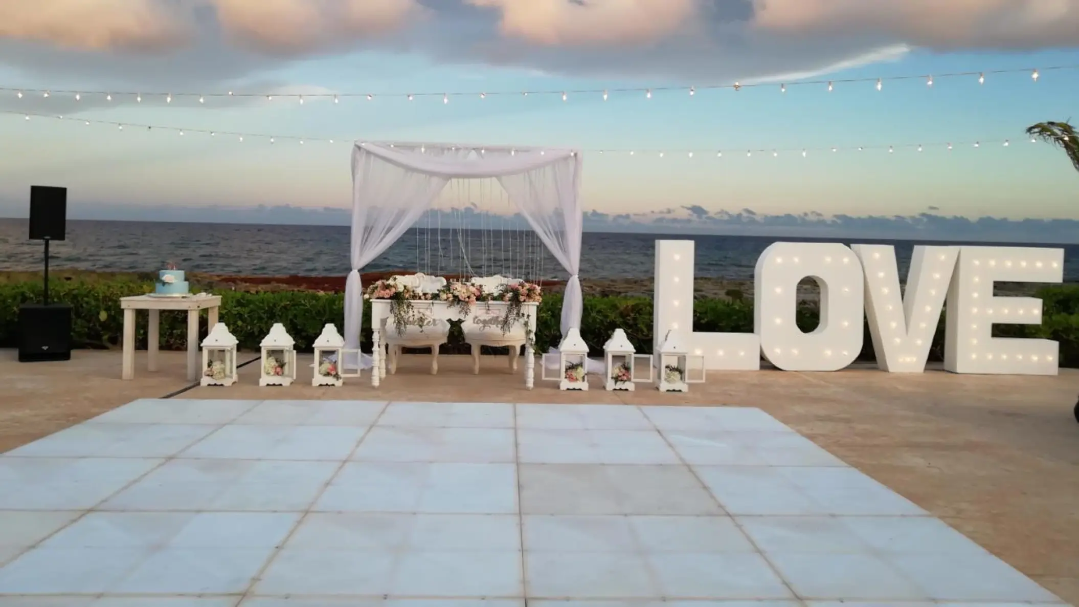 Sweetheart table and marquee LOVE letters on the Starlight Terrace at Hard Rock Riviera Maya