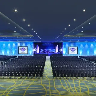 Large ballroom reception with blue lighting at Hard Rock Riviera Maya