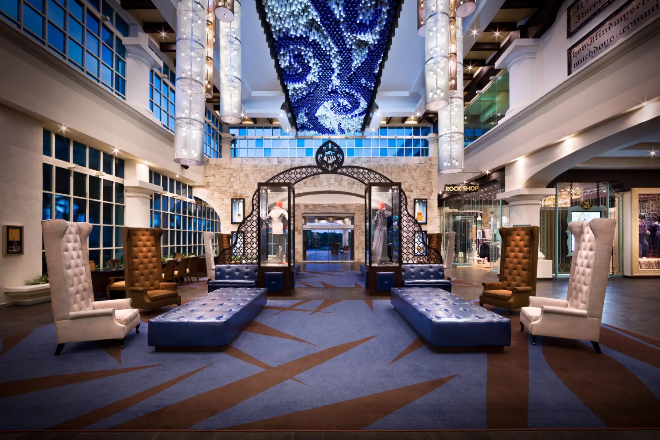 Lobby with high ceilings and blue lighting at Hard Rock Riviera Maya