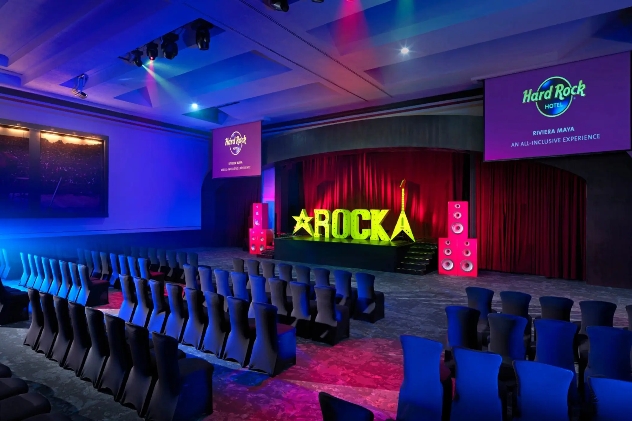 Indoor theater with stage and seating at Hard Rock Riviera Maya