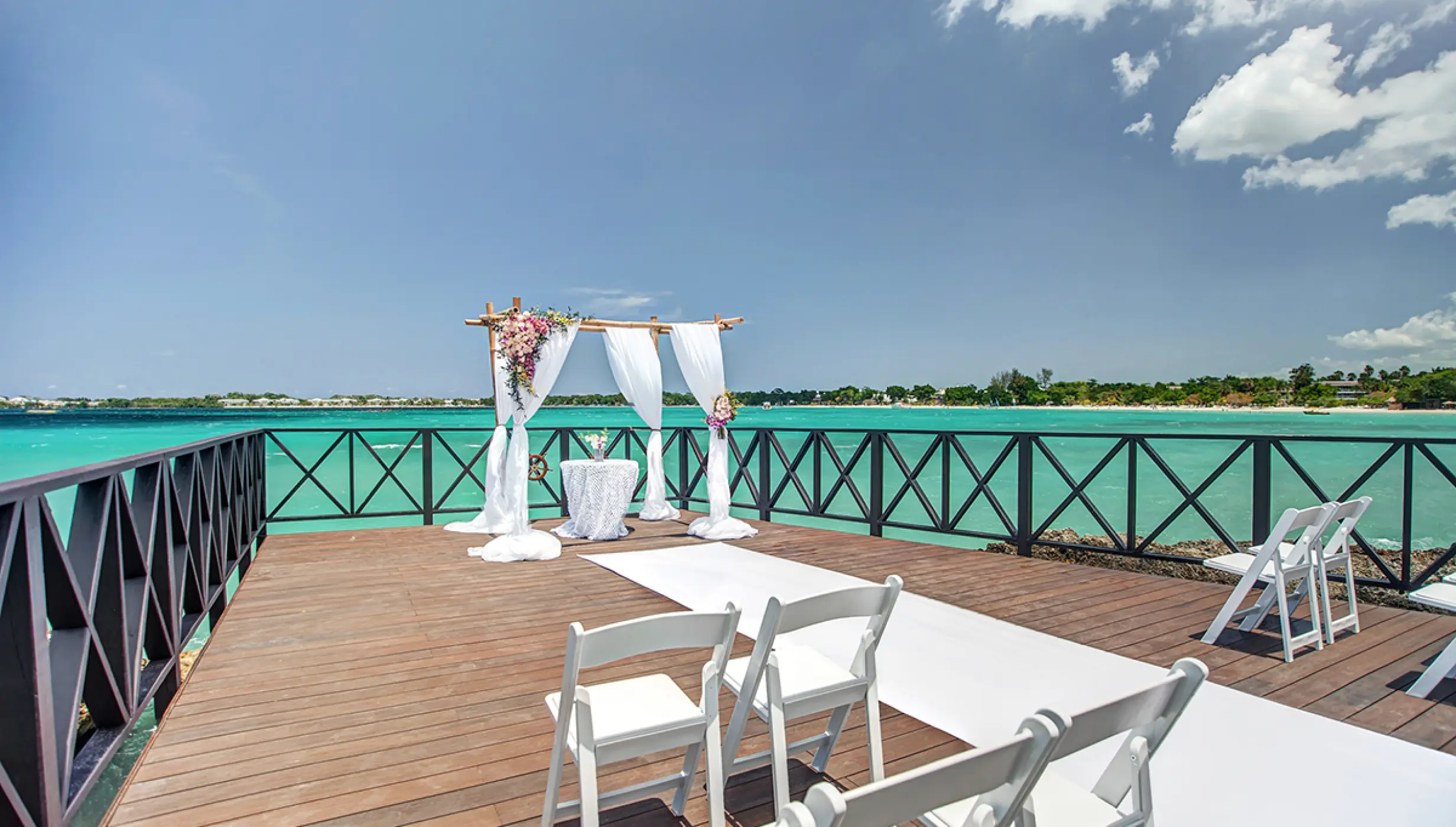 Ceremony decor in the charmin ocean pier at Hideaway at Royalton Negril