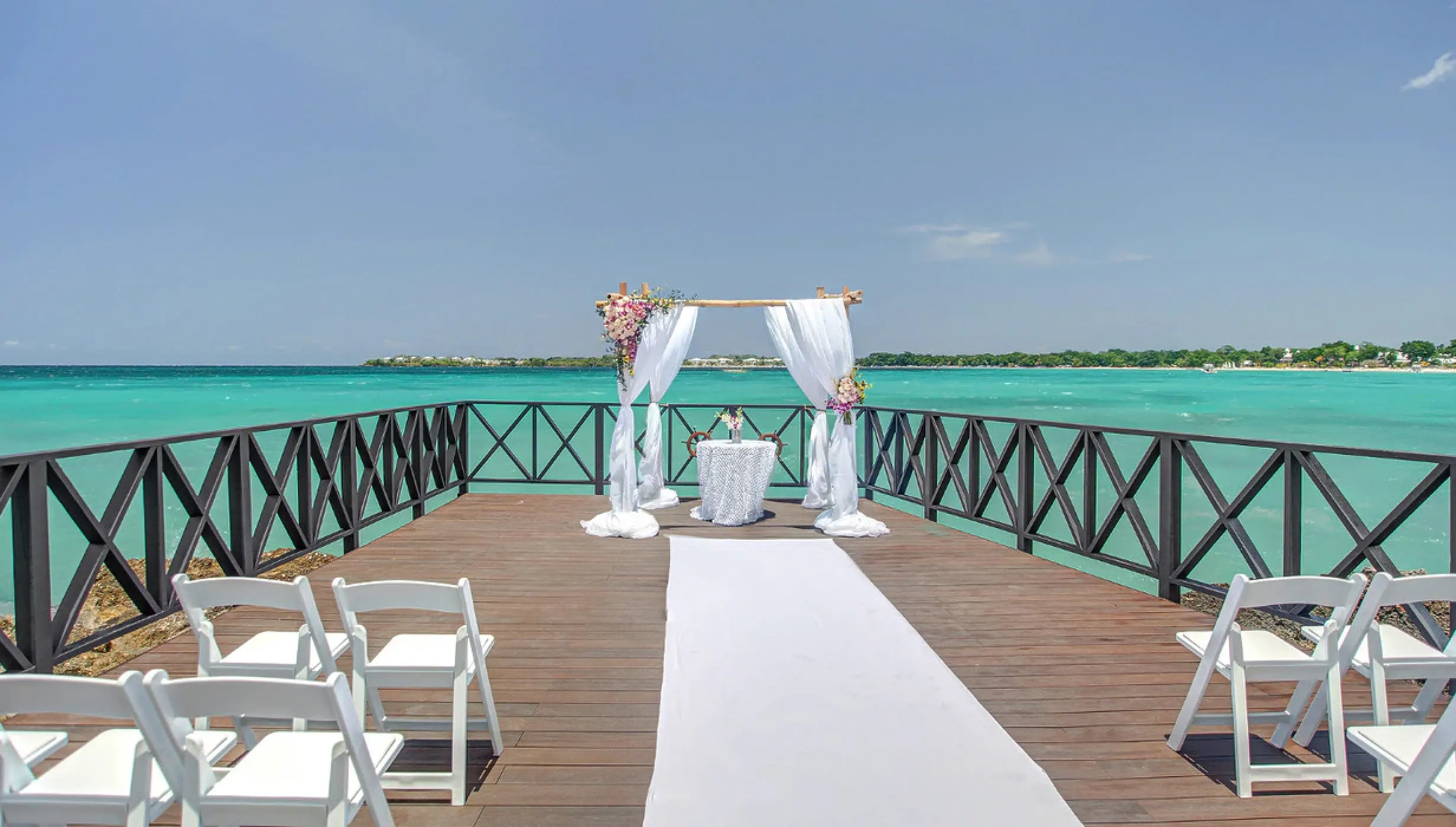 Ceremony decor in the charmin ocean pier at Hideaway at Royalton Negril